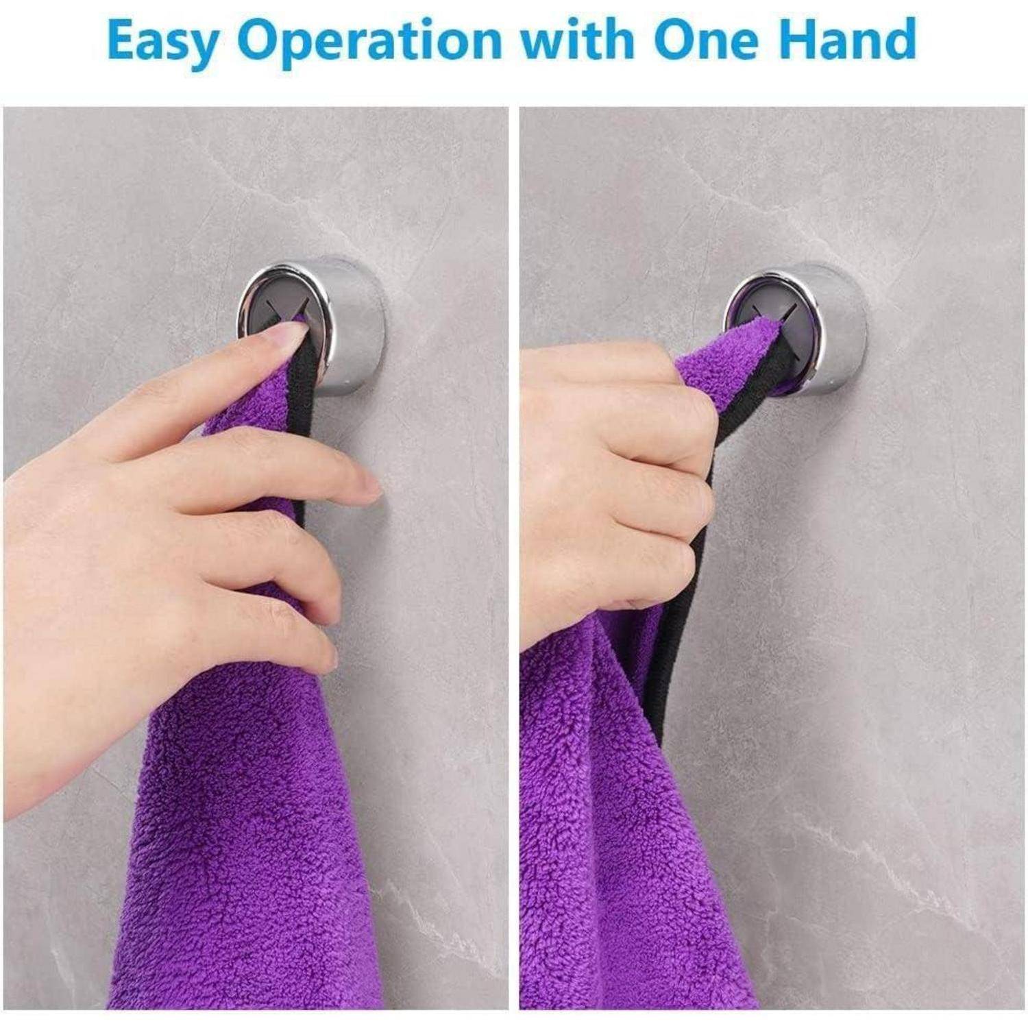 Zwei Bilder zeigen eine Hand, die ein lila Handtuch in einen Wandhaken ein- und aushängt. Der Text lautet: „Einfache Bedienung mit nur einer Hand.