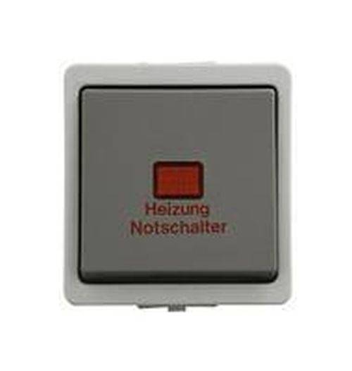 Ein grauer quadratischer Schalter mit einem roten Knopf, beschriftet mit 'Heizung Notschalter', der als Notheizungsschalter gekennzeichnet ist.