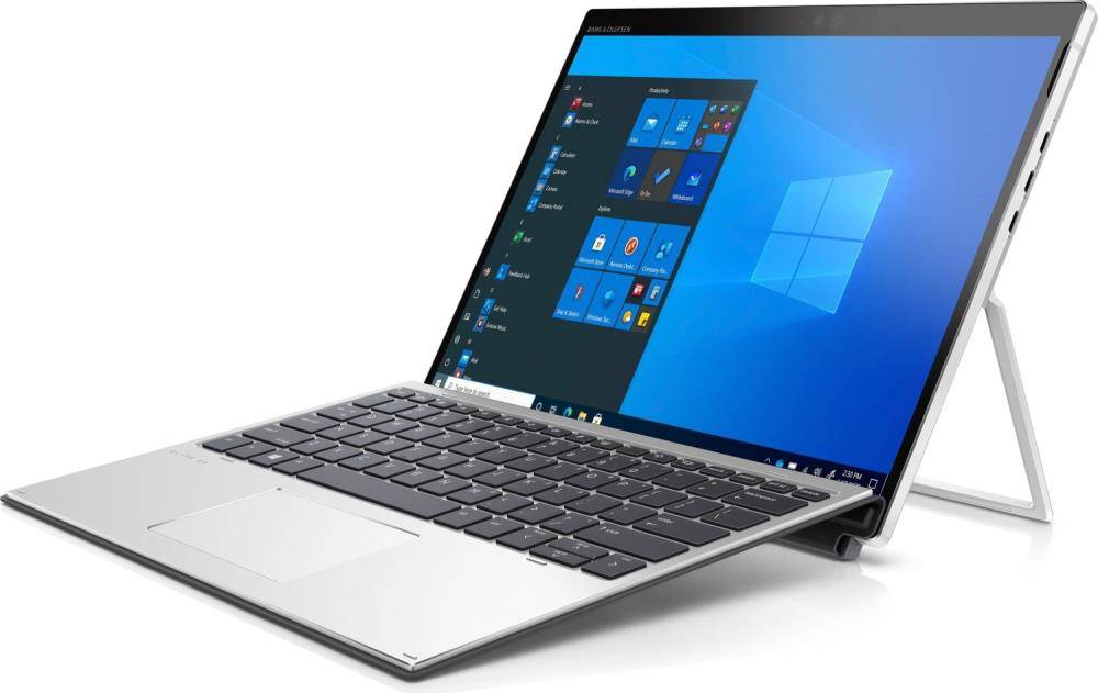 Ein silberner Laptop mit abnehmbarer Tastatur führt Windows 10 aus. Der Bildschirm zeigt das Windows-Startmenü mit gängigen Anwendungssymbolen.