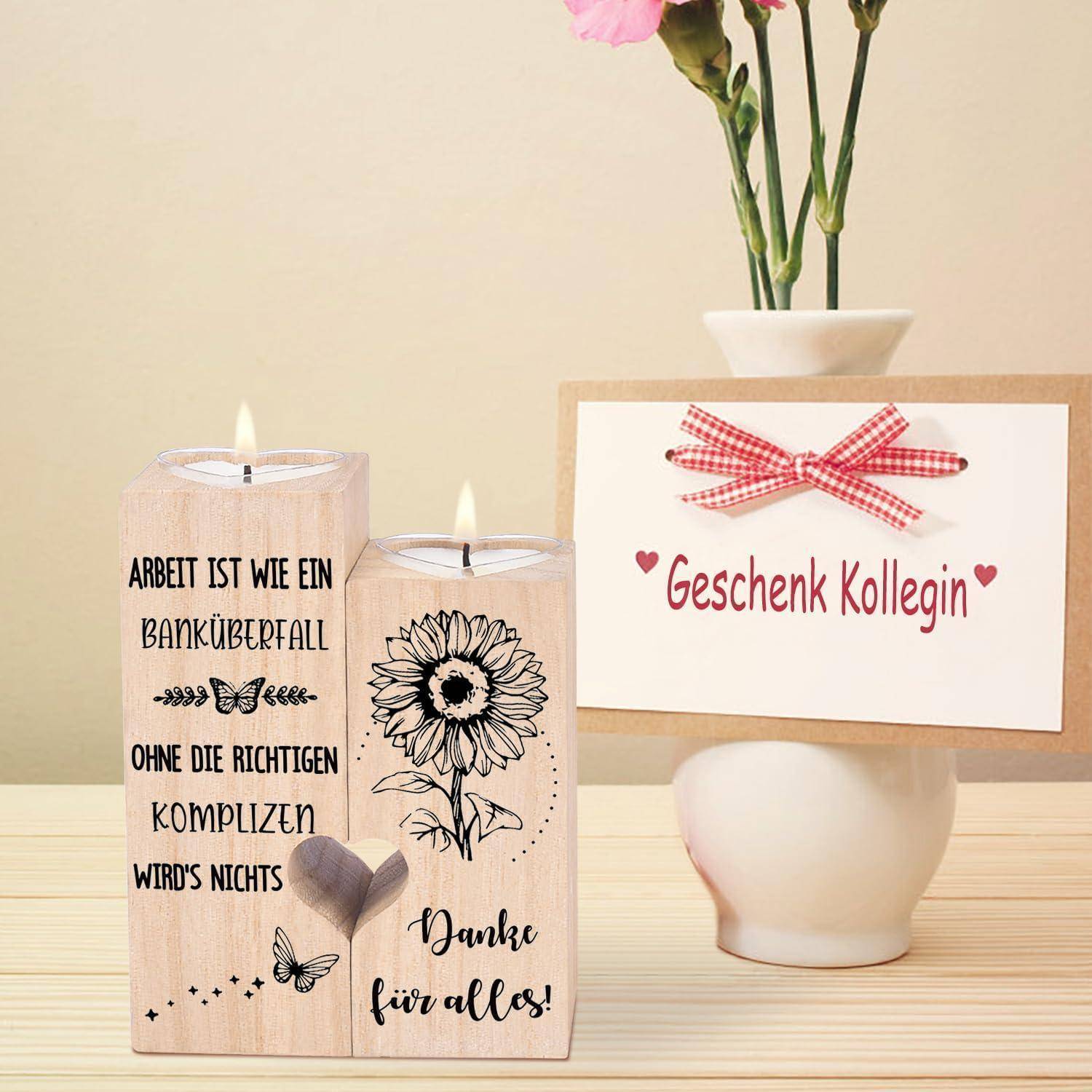 Zwei brennende Kerzen mit deutschem Text und Sonnenblumendesign auf einer; der größere Text sagt: „Danke für alles!