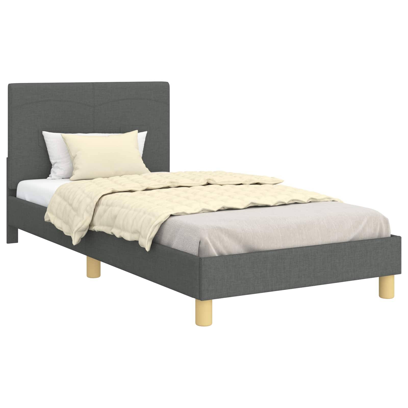 Ein Einzelbett mit grauem Polsterrahmen, hellen Holzbeinen und cremefarbener Bettwäsche mit Kissen.