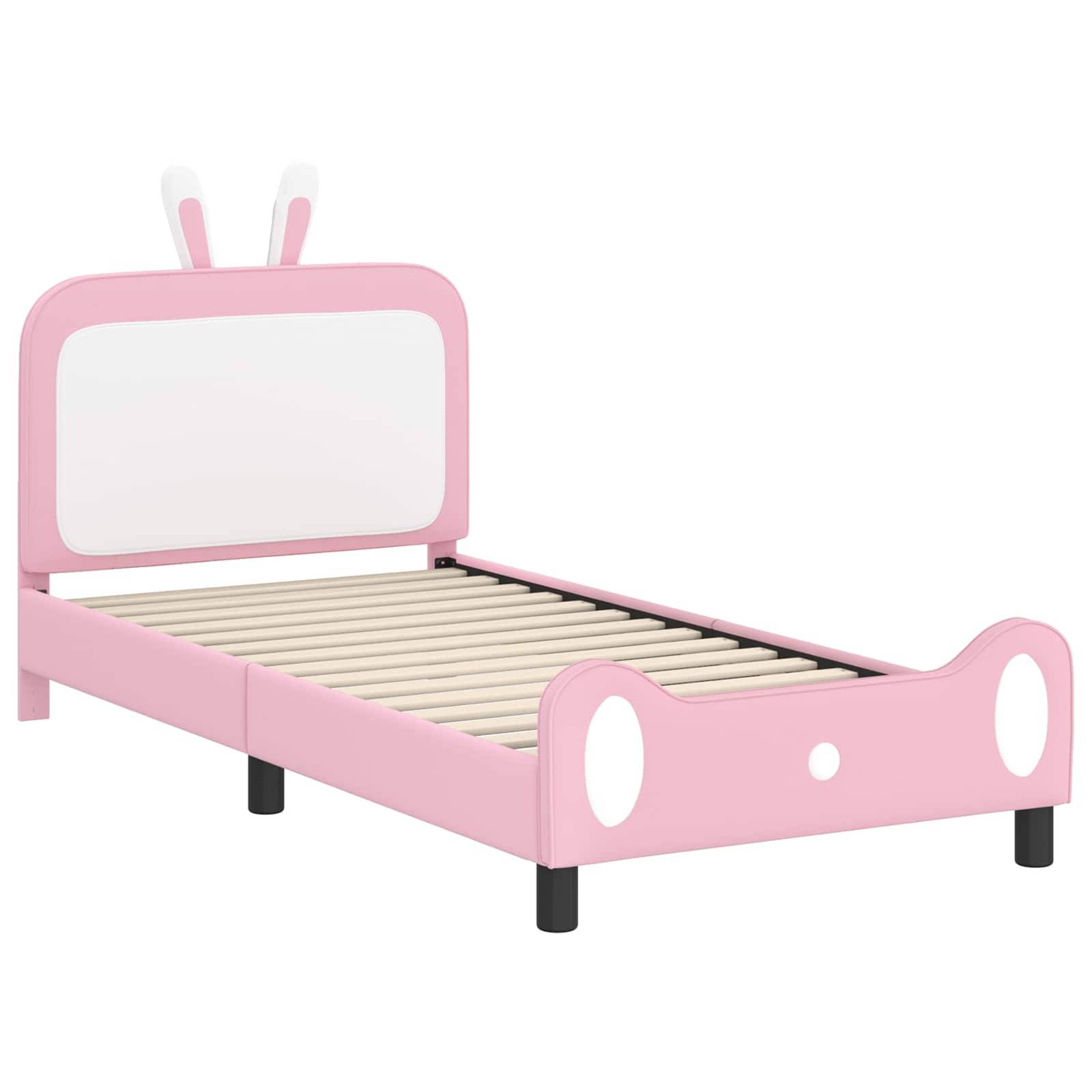 Ein rosa Kinderbettgestell mit niedlichen runden Akzenten und hasenohrähnlichen Kopfteilelementen, ausgestattet mit einem Lattenrost.