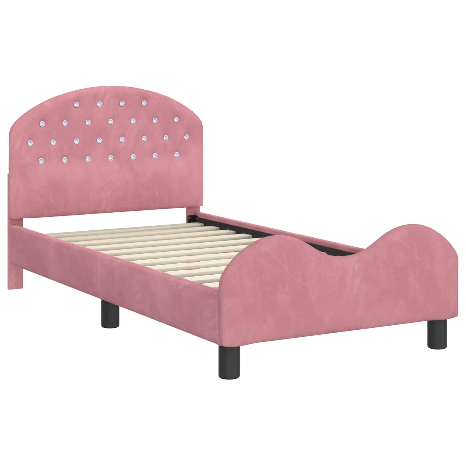 Ein rosa Kleinkindbett mit dekorativen Details am Kopfteil und ohne Matratze. Das Bettgestell ist einfach gestaltet und für kleine Kinder konzipiert.