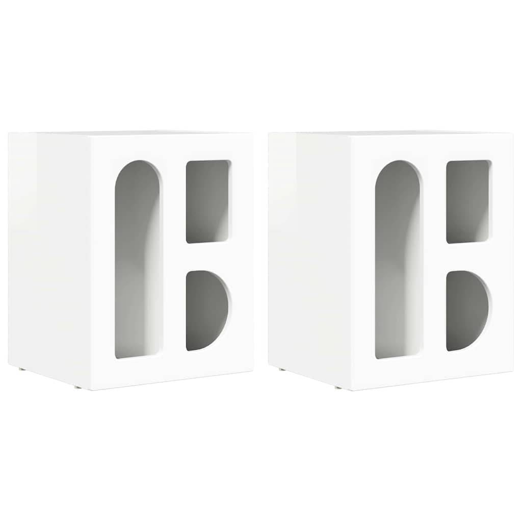 Zwei weiße Wandschränke mit ovalen Ausschnitten in den Türen, die jeweils ein Regal im Inneren haben. Das Design ist minimalistisch und modern.