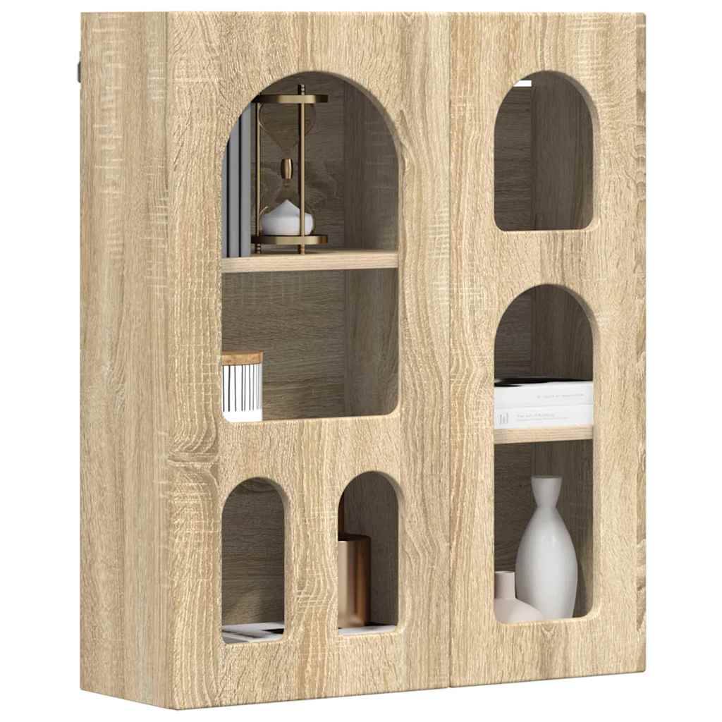 Ein kleiner schwarzer Holzbeistelltisch mit einer Tasse und einer Pflanze obenauf, neben einem hellfarbigen Sofa in einer modernen Wohnzimmereinrichtung positioniert.