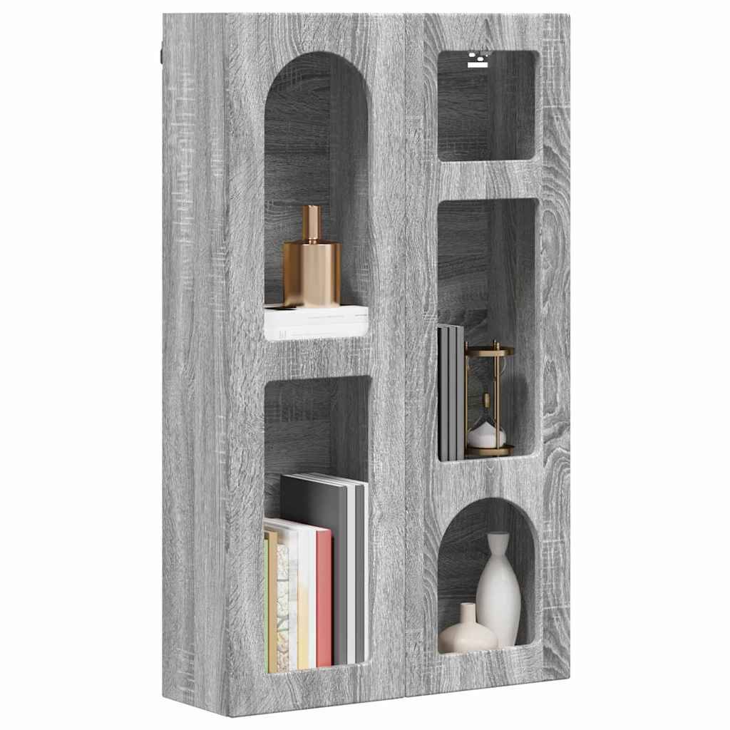 Ein grauer Holzwandregal mit vier Nischen. Er hält Dekorationsgegenstände, darunter eine goldene Vase, eine Sanduhr, Bücher und eine weiße Skulptur.