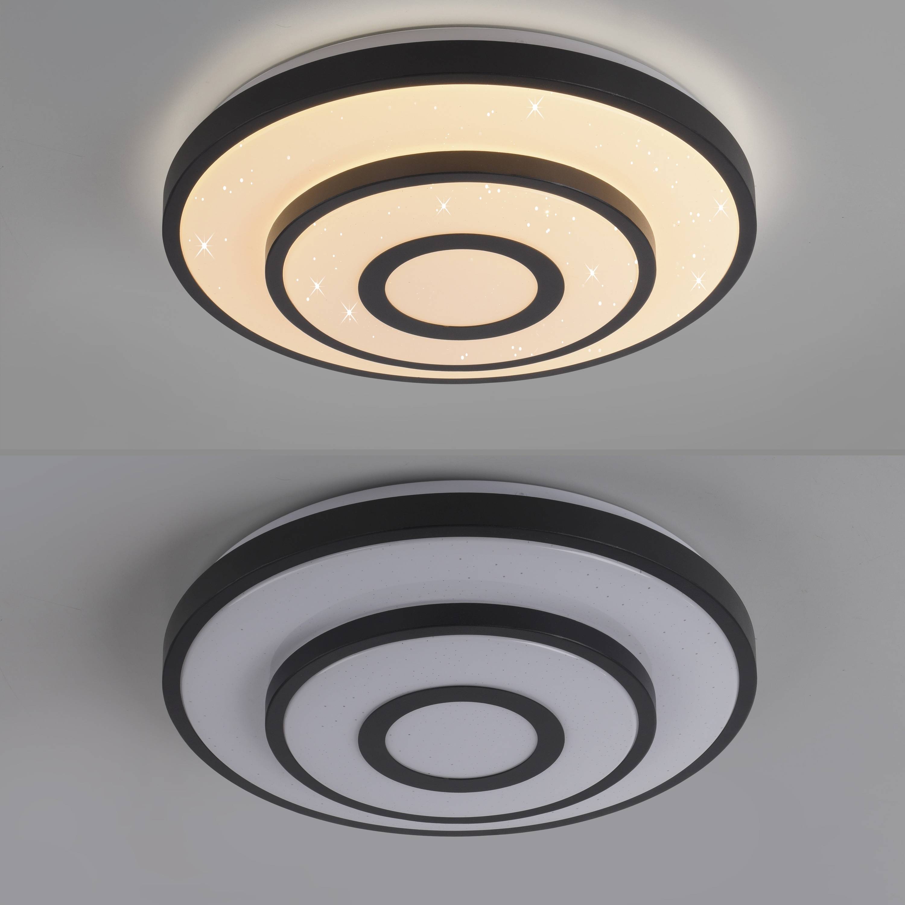 Zwei moderne runde Deckenleuchten; obere Lampe sendet warmes Licht mit sternartigen Pünktchen aus, untere Lampe ist ausgeschaltet oder sendet sehr gedämpftes Licht.