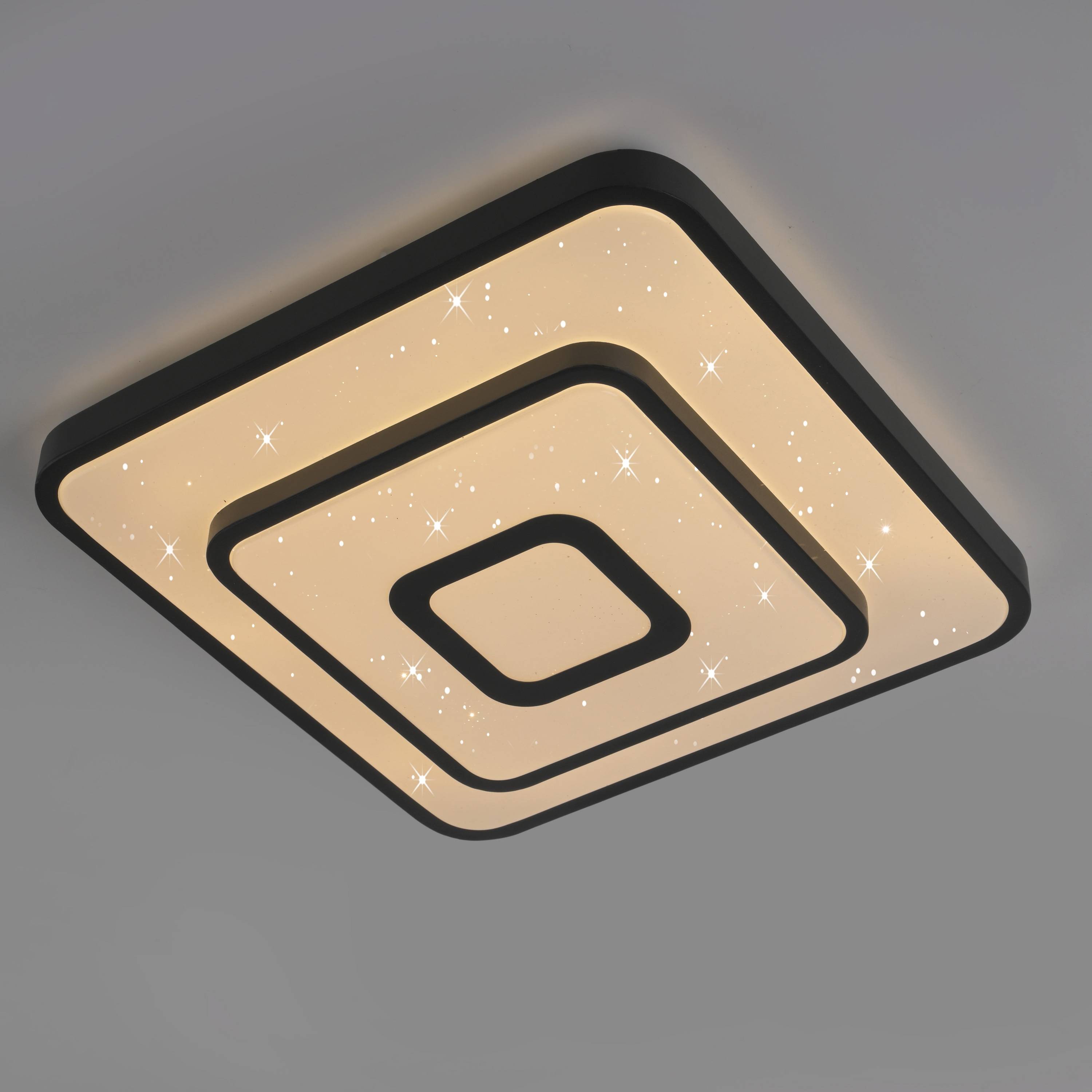 Quadratische, moderne Deckenleuchte mit konzentrischen Quadraten und sternenartigen Funkeleffekten, die ein warmes weißes Licht in minimalistischem Design ausstrahlt.