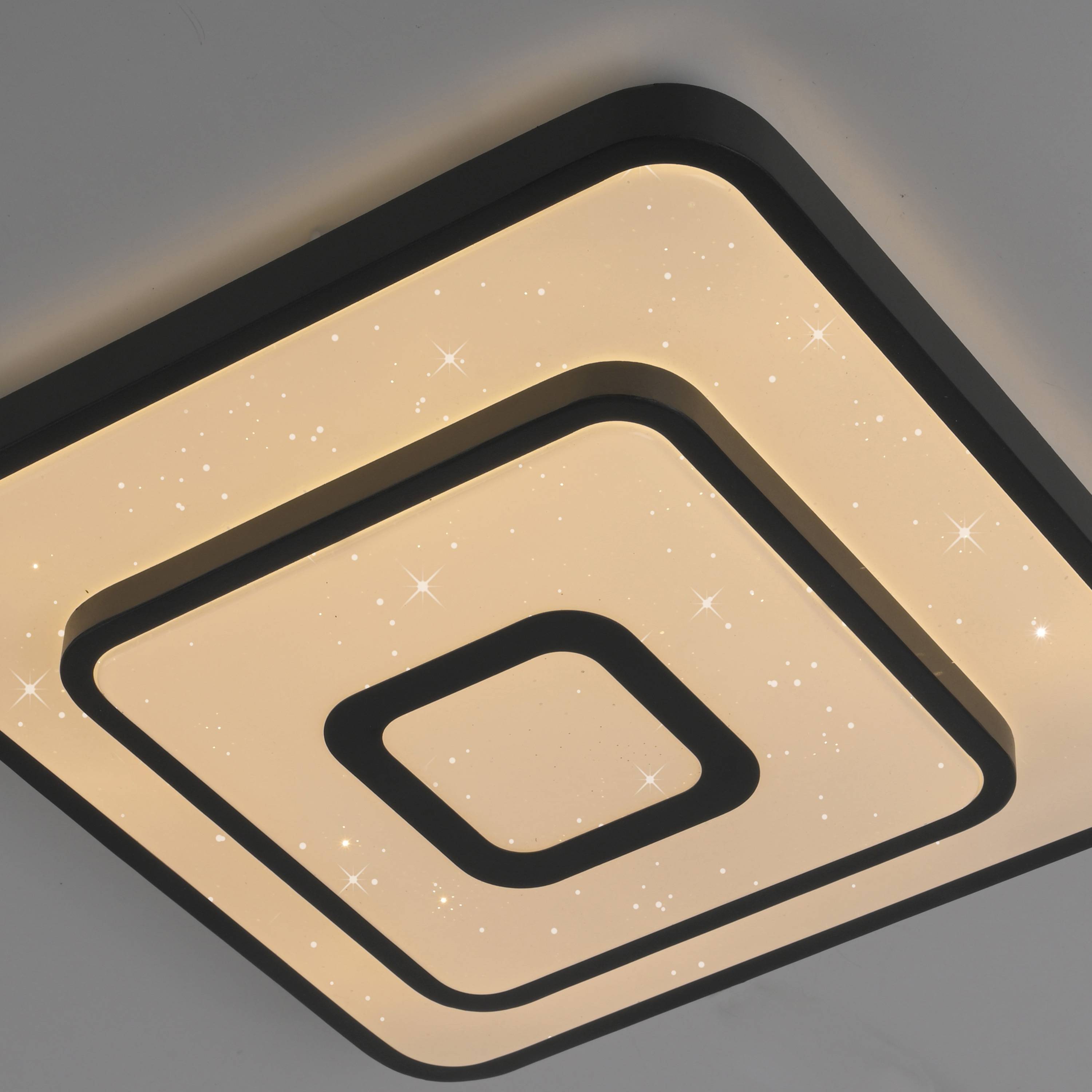 Quadratische Deckenleuchte mit konzentrischen Mustern, sanft leuchtend und mit einem dezenten, sternenartigen Effekt.