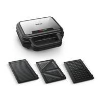 Ein Sandwichmaker mit drei auswechselbaren Platten: Grill, dreieckige Sandwichform und Waffelplatte. Das Markenlogo ist auf dem Deckel sichtbar.