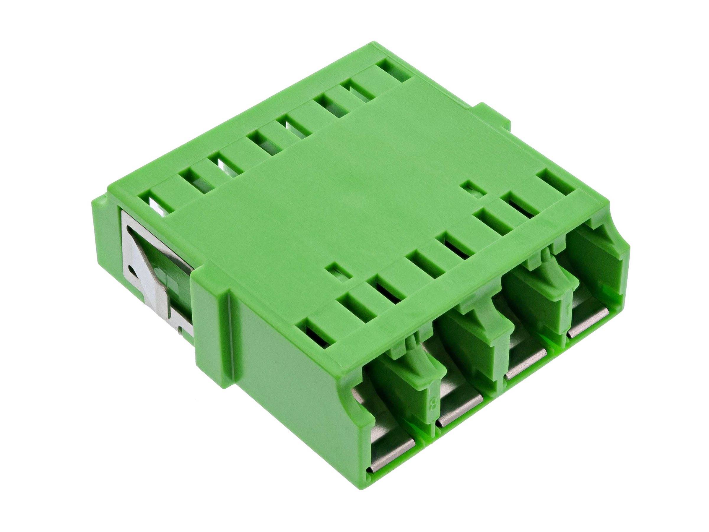 Ein grüner elektrischer Verbinder mit mehreren Steckplätzen und Metallclips, der zum Verbinden von Drähten in einem Schaltkreis oder elektronischen Gerät verwendet wird.