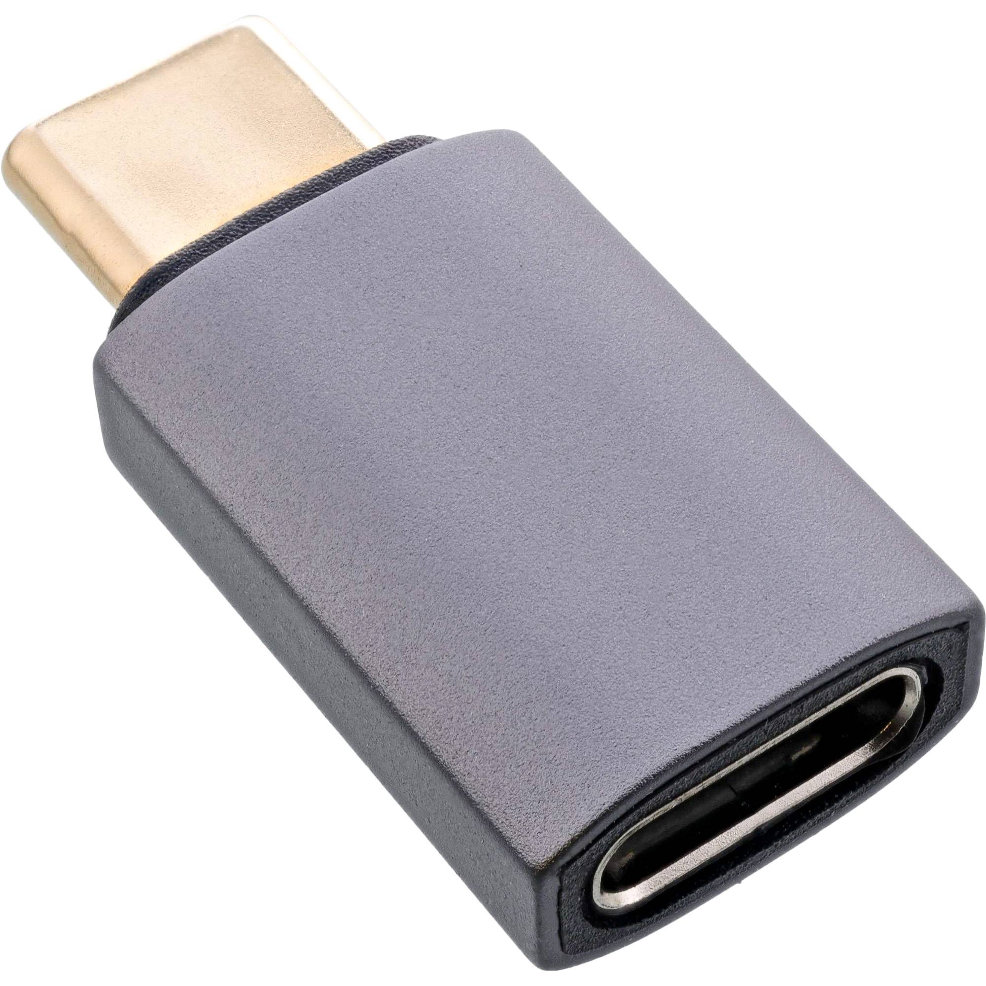 Ein USB-C zu USB-A Adapter mit grauem Gehäuse und goldenen Anschlüssen, entwickelt zum Anschluss von USB-C-Geräten an USB-A-Ports.