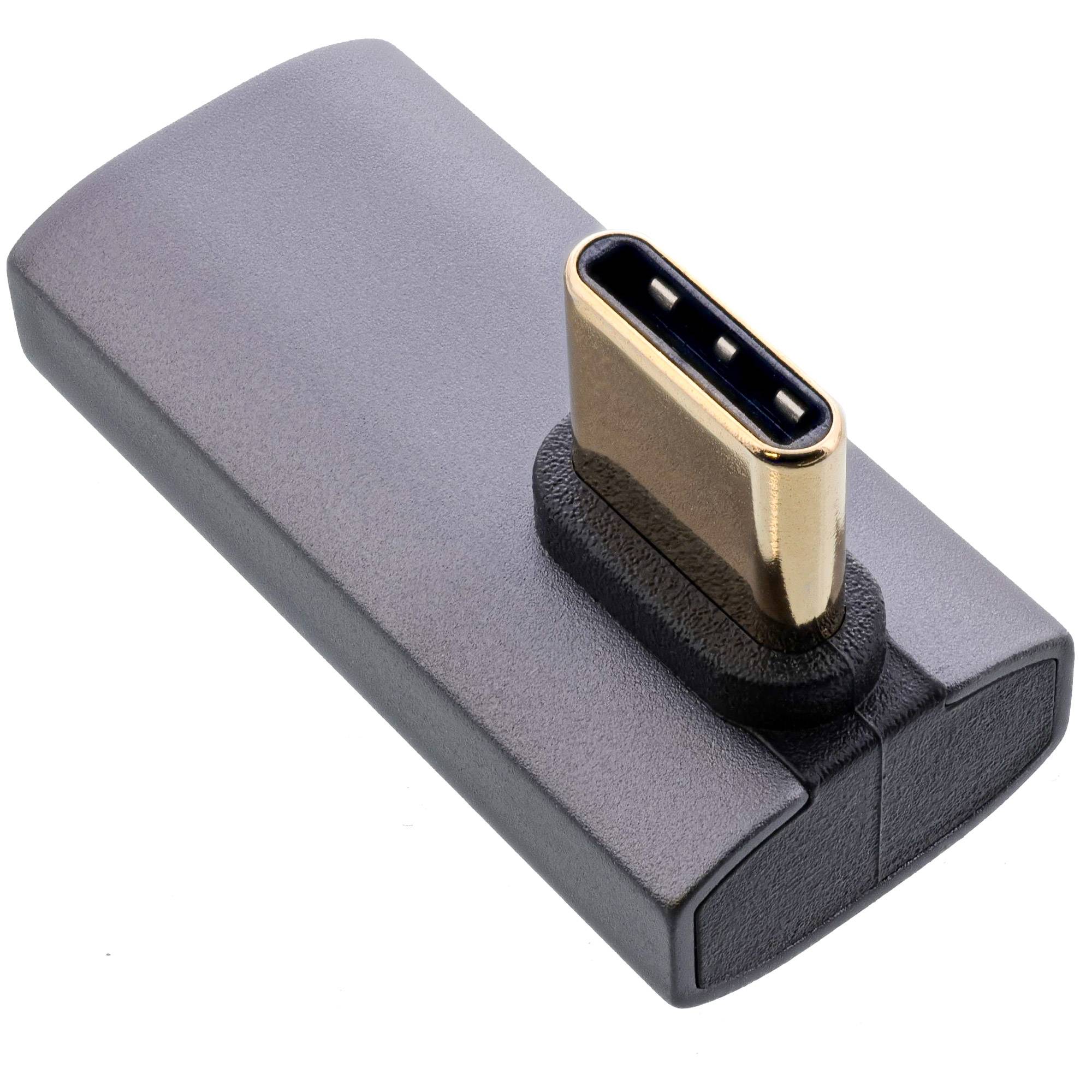 Ein Nahaufnahme-Bild eines USB-C zu USB-Adapters mit grauem Gehäuse und goldenem Anschluss, der zum Umwandeln von USB-C in einen Standard-USB-Anschluss verwendet wird.