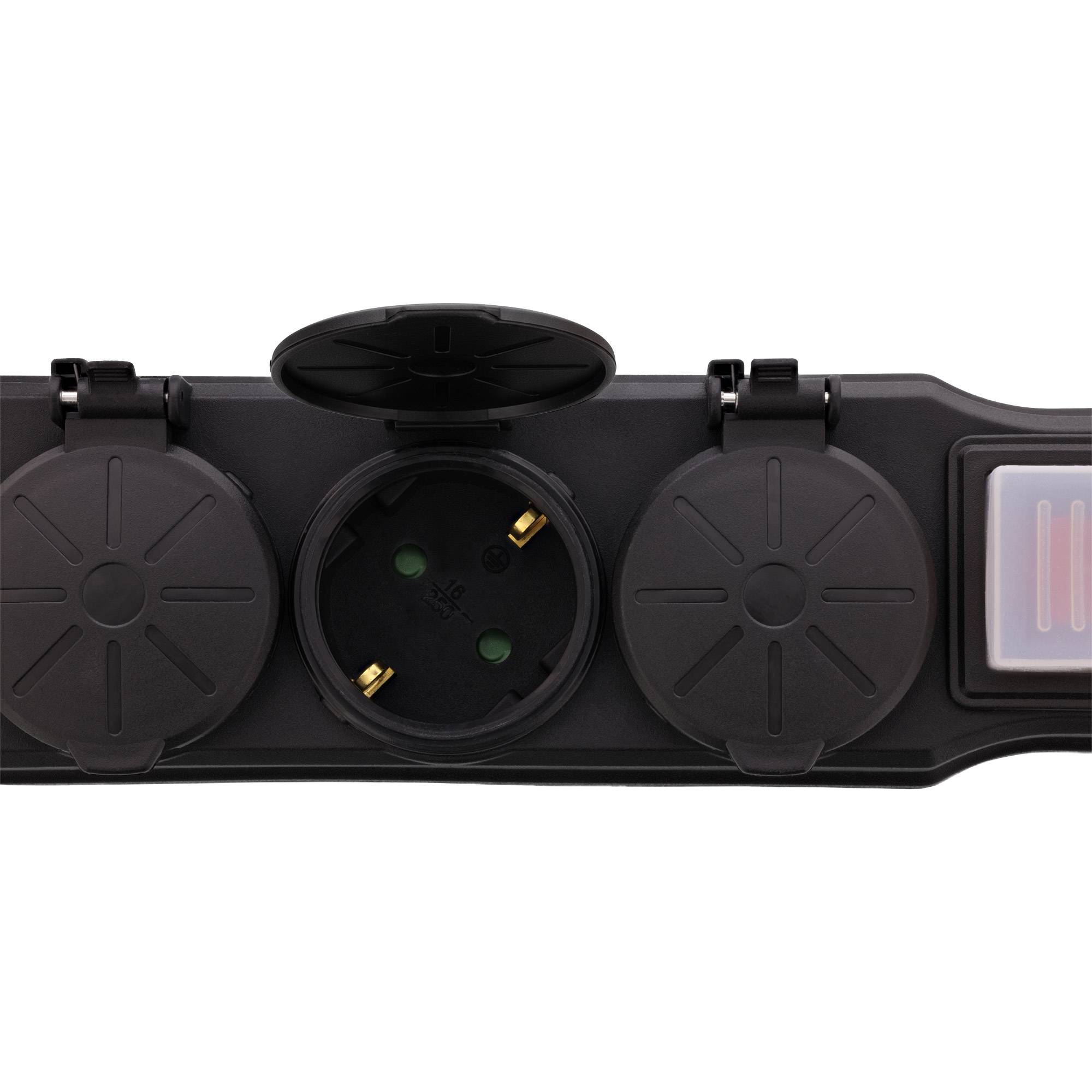 Ein schwarzes Steckerleiste mit drei runden Steckdosenabdeckungen, eine geöffnet, um eine Steckdose zu zeigen, und einem Schalter mit roten und grünen Kontrollleuchten.