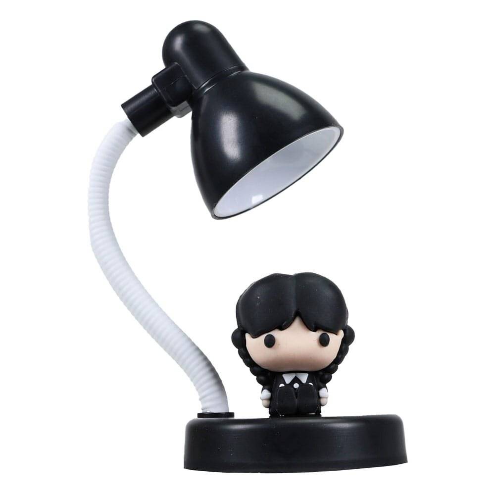 Schwarze Schreibtischlampe mit weißem flexiblem Hals und einer kleinen Puppe auf dem Sockel