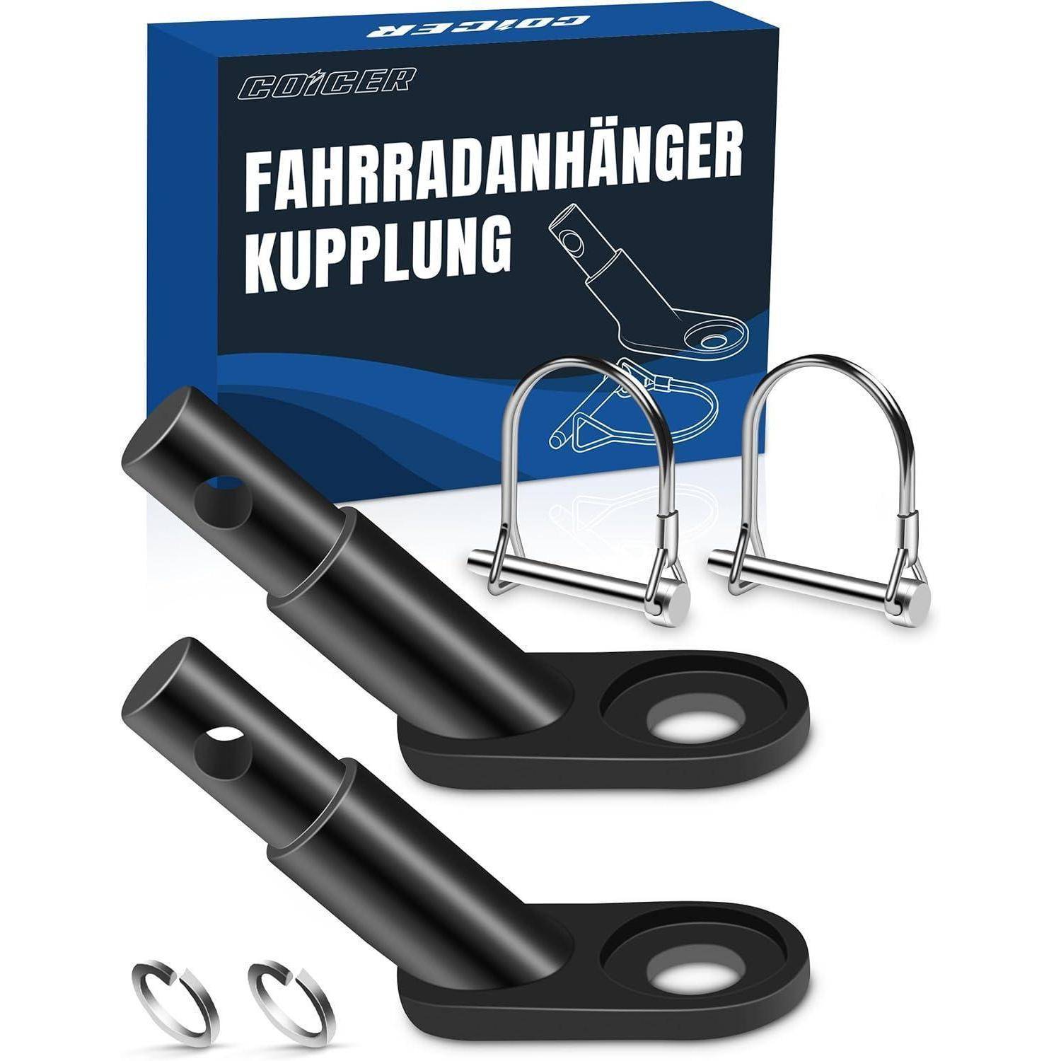 Fahrrradanhänger-Kupplungssatz mit zwei schwarzen Metallkupplungen, zwei U-Bolzen und zwei kreisrunden Metallringen, neben einer blauen Schachtel.