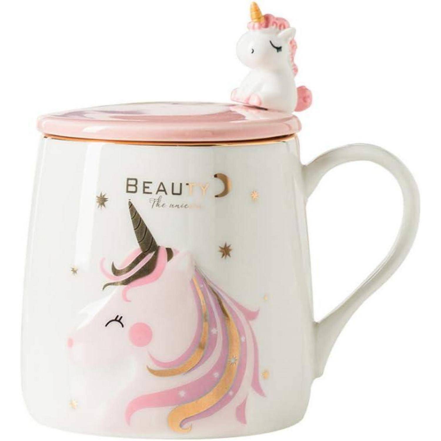 Eine weiße Tasse mit einem rosa Deckel, auf dem eine Einhornfigur sitzt. Die Tasse ist mit einer Einhorn-Illustration und dem Wort 'Beauty' verziert.