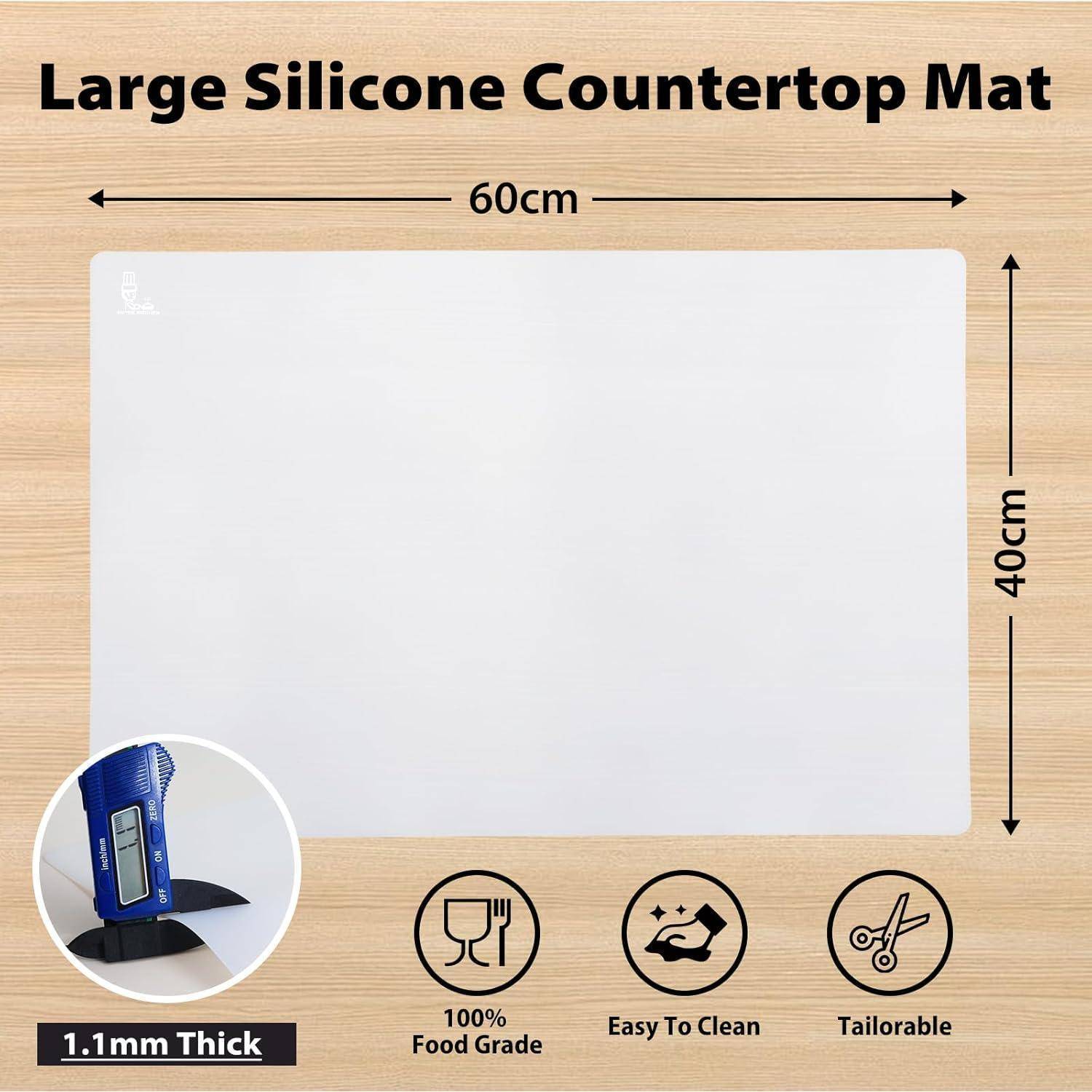 Großes Silikon-Arbeitsflächen-Matte mit Abmessungen von 60 cm x 40 cm, ausgestattet mit Symbolen für '1,1 mm dick', '100% lebensmittelecht', 'Einfach zu reinigen' und 'Individuell zuschneidbar'.