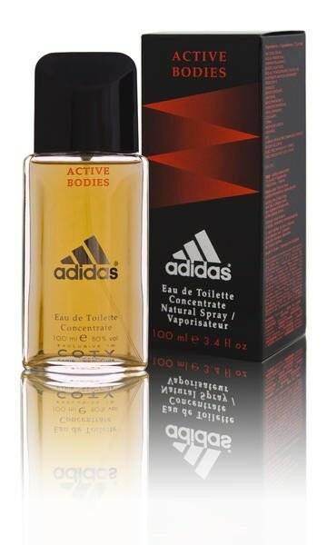 Eine transparente Glasflasche von Adidas 'Active Bodies' Eau de Toilette, 100ml, neben einer schwarzen und roten Box mit Produktdetails.