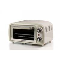 Ein kleiner, im Retro-Stil gehaltener beiger Minibackofen mit zwei Regelknöpfen und einer Glastür, geeignet zum Toasten und für kleine Backaufgaben.
