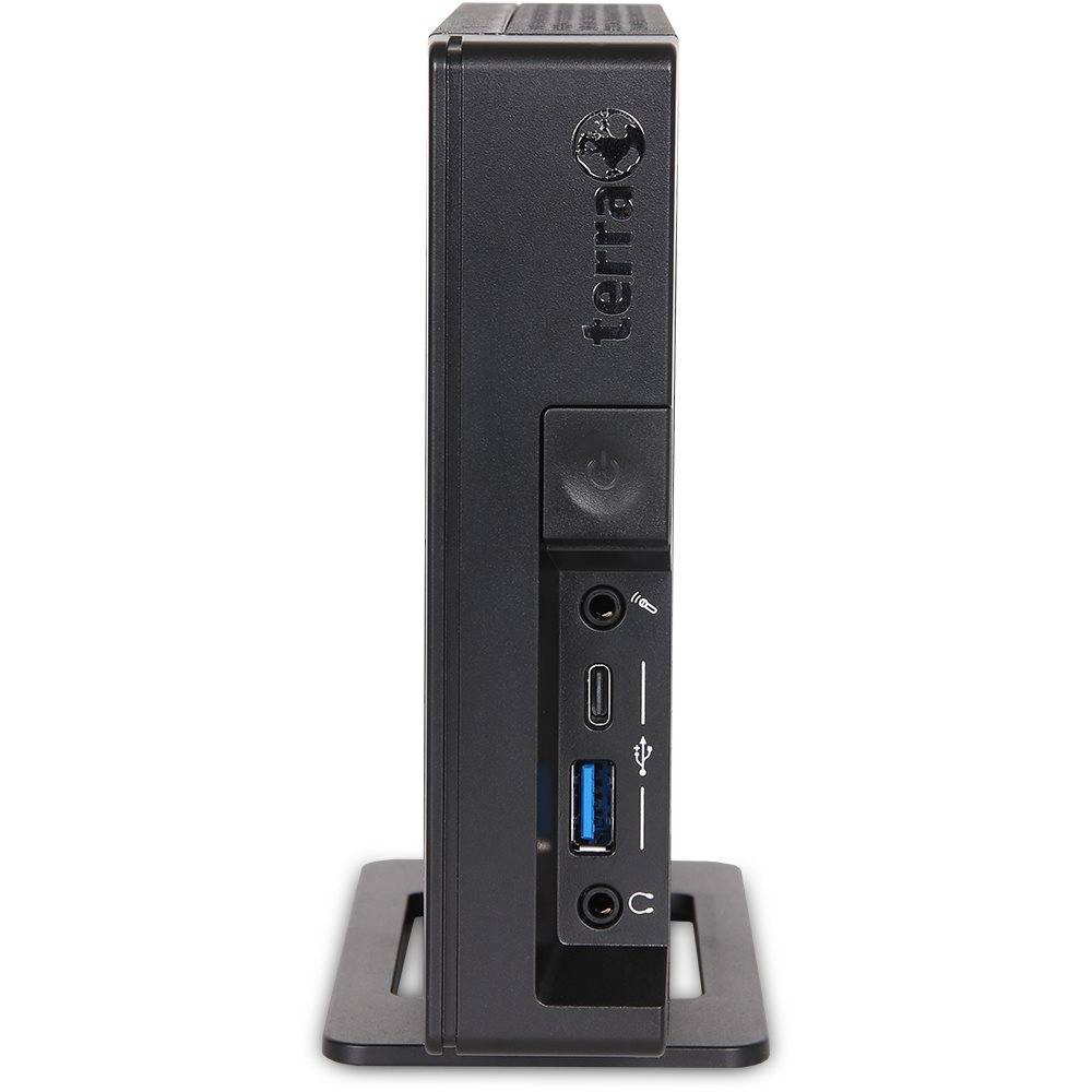 Mini-PC der Marke 'Terra' in vertikaler Ausrichtung. Frontplatte zeigt Einschaltknopf, USB-Anschlüsse, Kopfhörerbuchse. Kompaktes Design für Platzsparsamkeit.