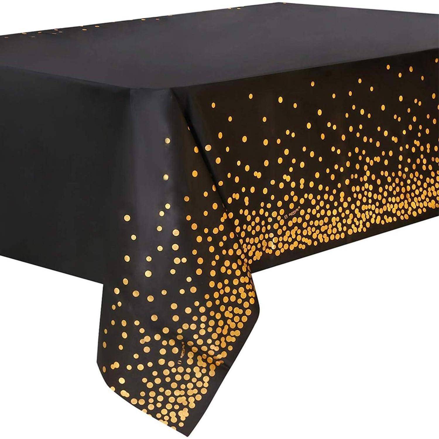 Eine schwarze Tischdecke mit einem goldenen Punktmuster entlang der Kanten, die einen festlichen Look für Feierlichkeiten oder besondere Anlässe schafft.