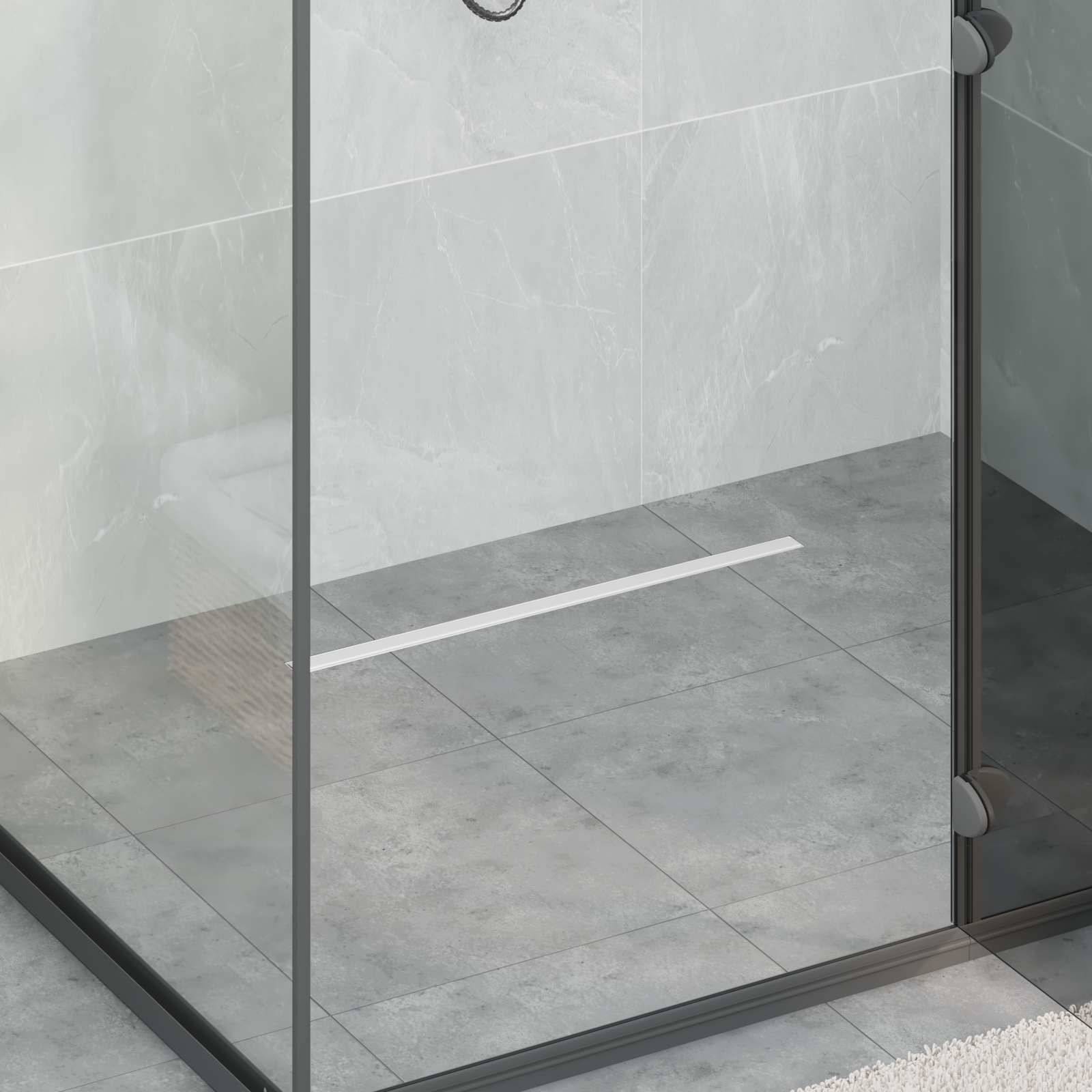 Glasdusche mit schwarzem Rahmen auf grauem Fliesenboden.