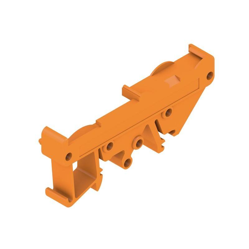Eine orangefarbene Kunststoffkomponente mit mehreren Kerben und Aussparungen, möglicherweise Teil eines größeren mechanischen oder elektronischen Montagsystems.