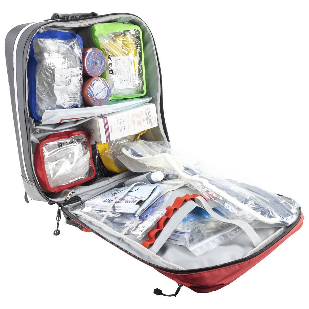 Eine geöffnete Erste-Hilfe-Notfallausrüstung, die verschiedene medizinische Verbrauchsmaterialien wie Verbände, Handschuhe und verpackte Ausrüstung in Fächern sortiert zeigt.