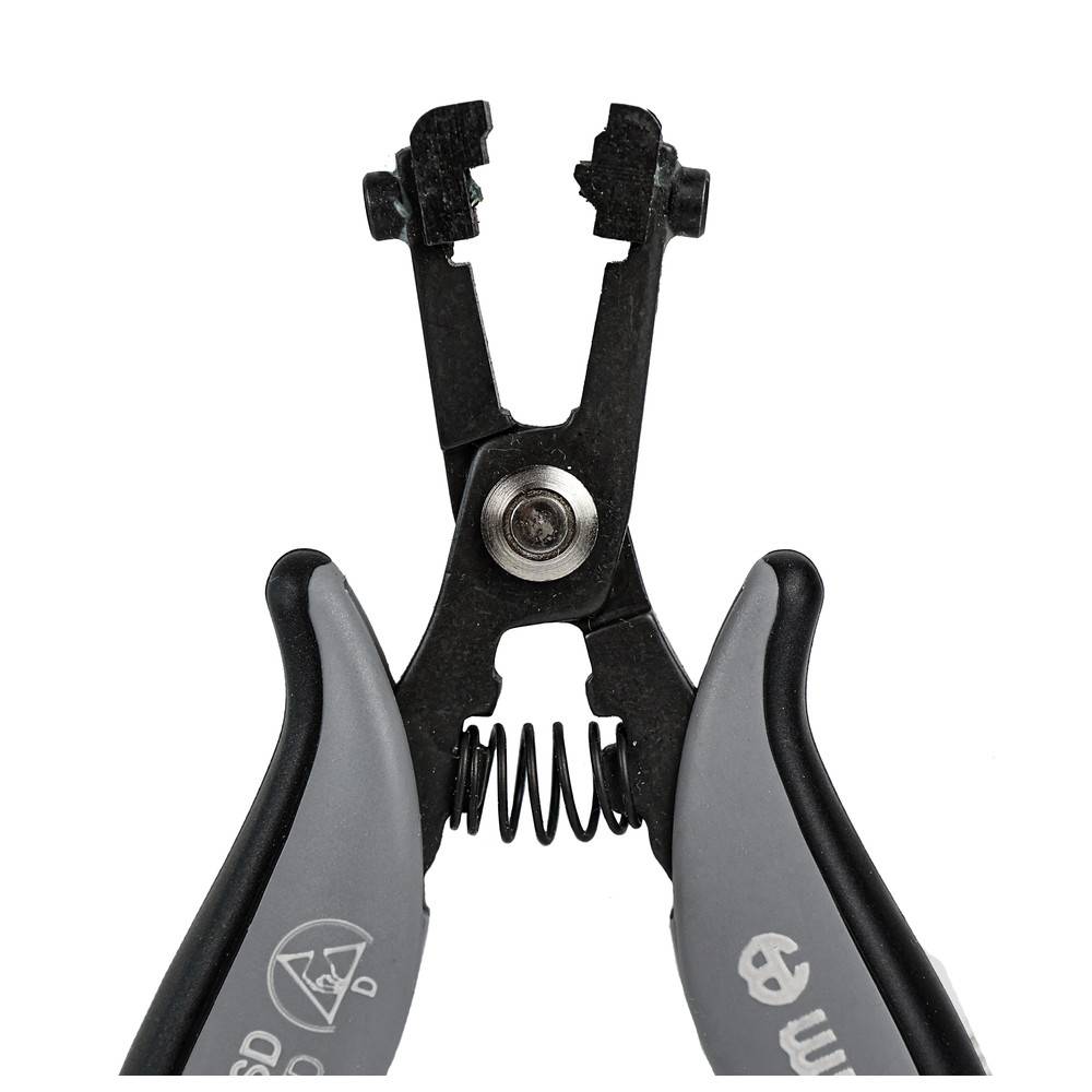 Abisolierzange mit ergonomischen Griffen, schwarze Backen geöffnet, Federmechanismus zur Entfernung der Isolierung von Drähten sichtbar.