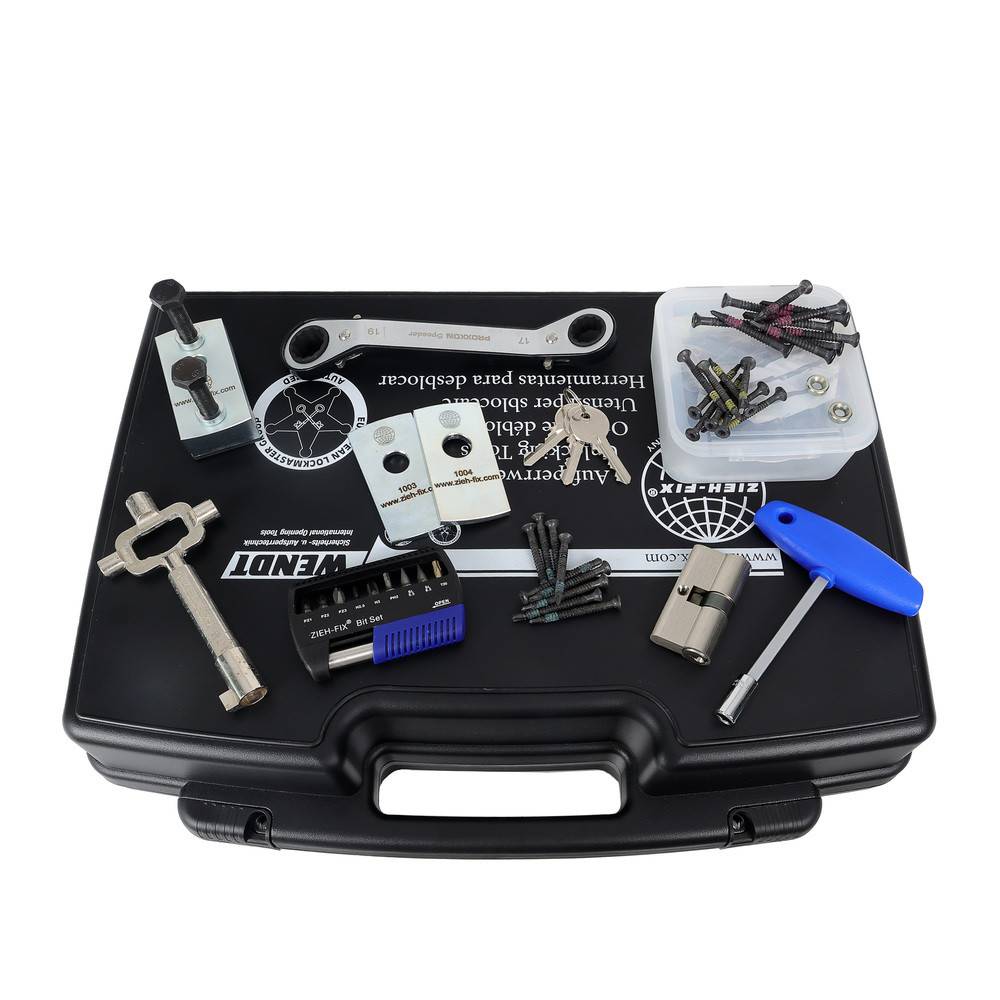 Werkzeugkasten mit verschiedenen Werkzeugen und Schrauben, einschließlich Schraubenschlüssel, Schraubendreher und Werkzeugteilen auf einem schwarzen Gehäuse, konzipiert für Fahrradwartung.