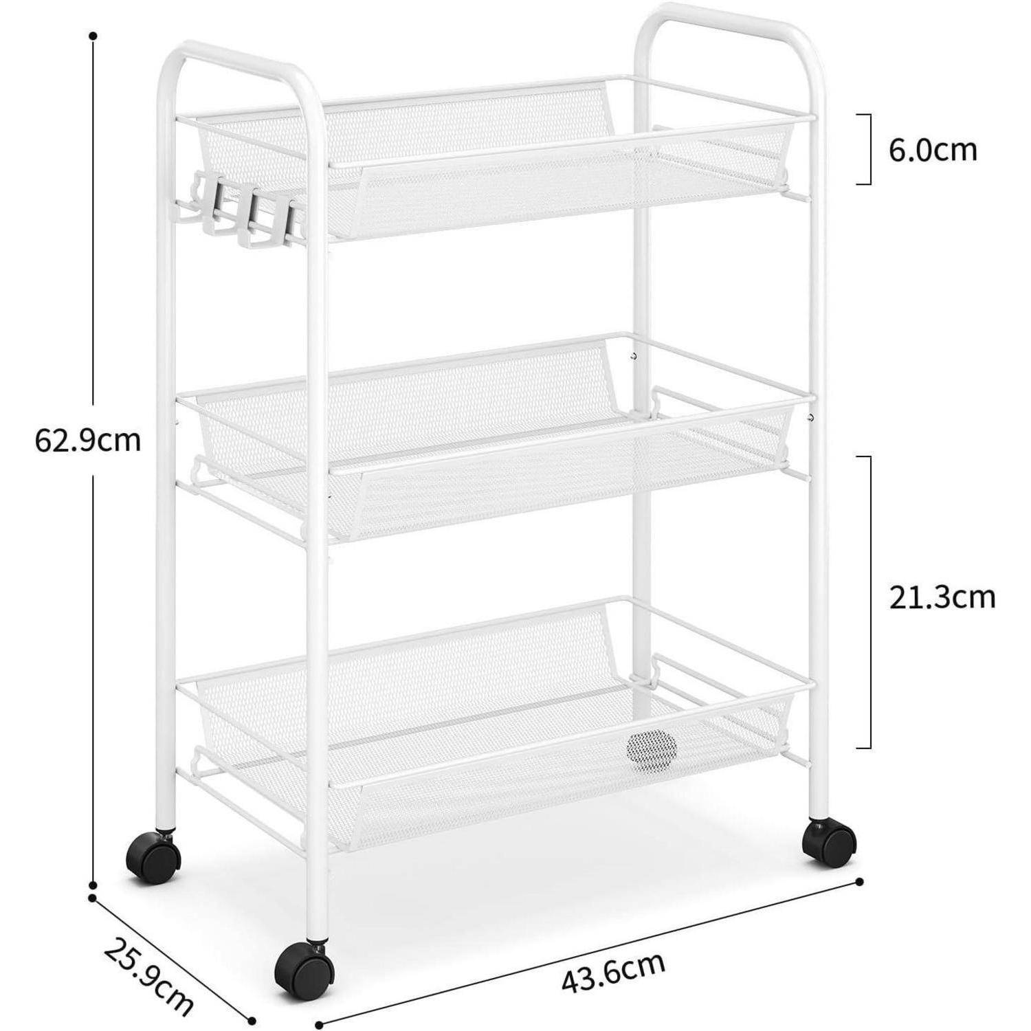 Ein weißer Metallwagen mit Rollen und drei Gitterablageböden wird gezeigt. Die Abmessungen sind beschriftet: Höhe 62,9 cm, Breite 43,6 cm, Tiefe 25,9 cm.