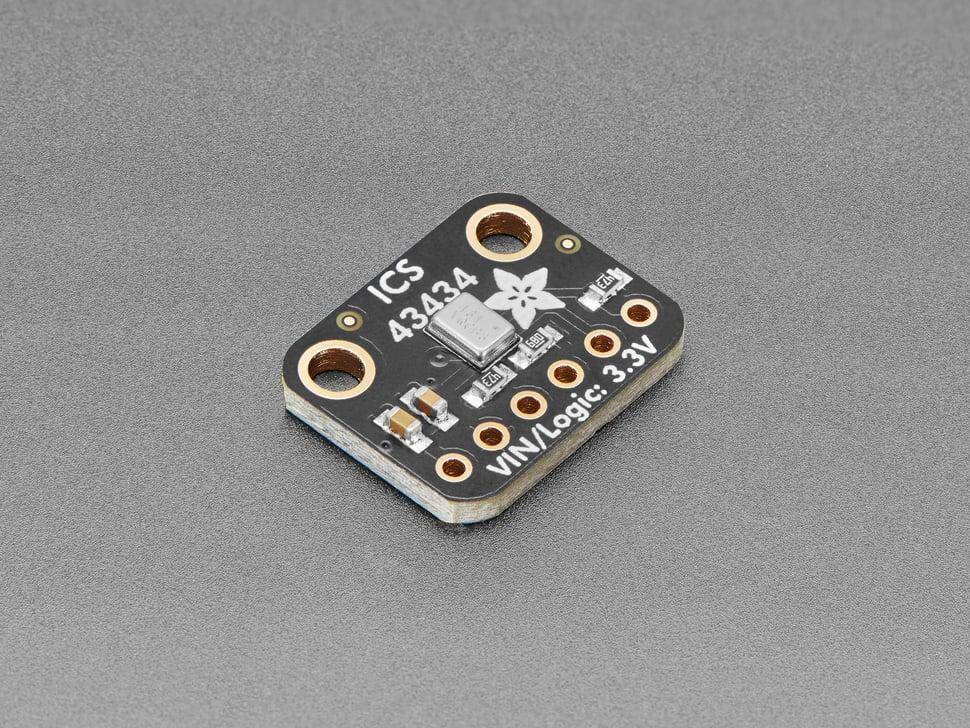 „Eine schwarze Leiterplatte mit der Bezeichnung ICS 43434, ausgestattet mit fünf Anschlüssen und einem kleinen Logo, die für VIN/Logic 3,3V-Verbindungen entwickelt wurde.