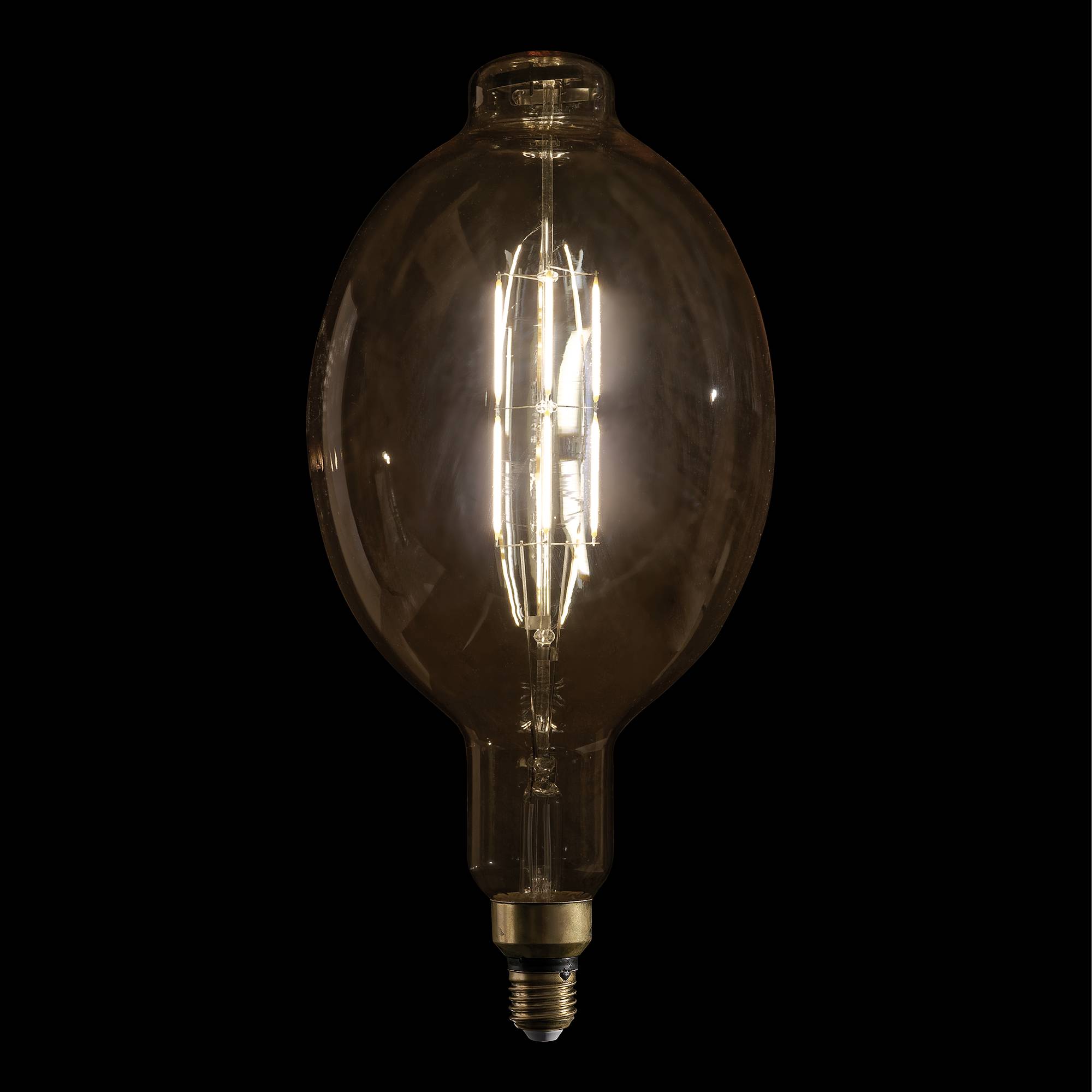 Eine leuchtende Glühfadenlampe vor einem dunklen Hintergrund, die ihr Vintage-Design und warmes Licht zur Geltung bringt.
