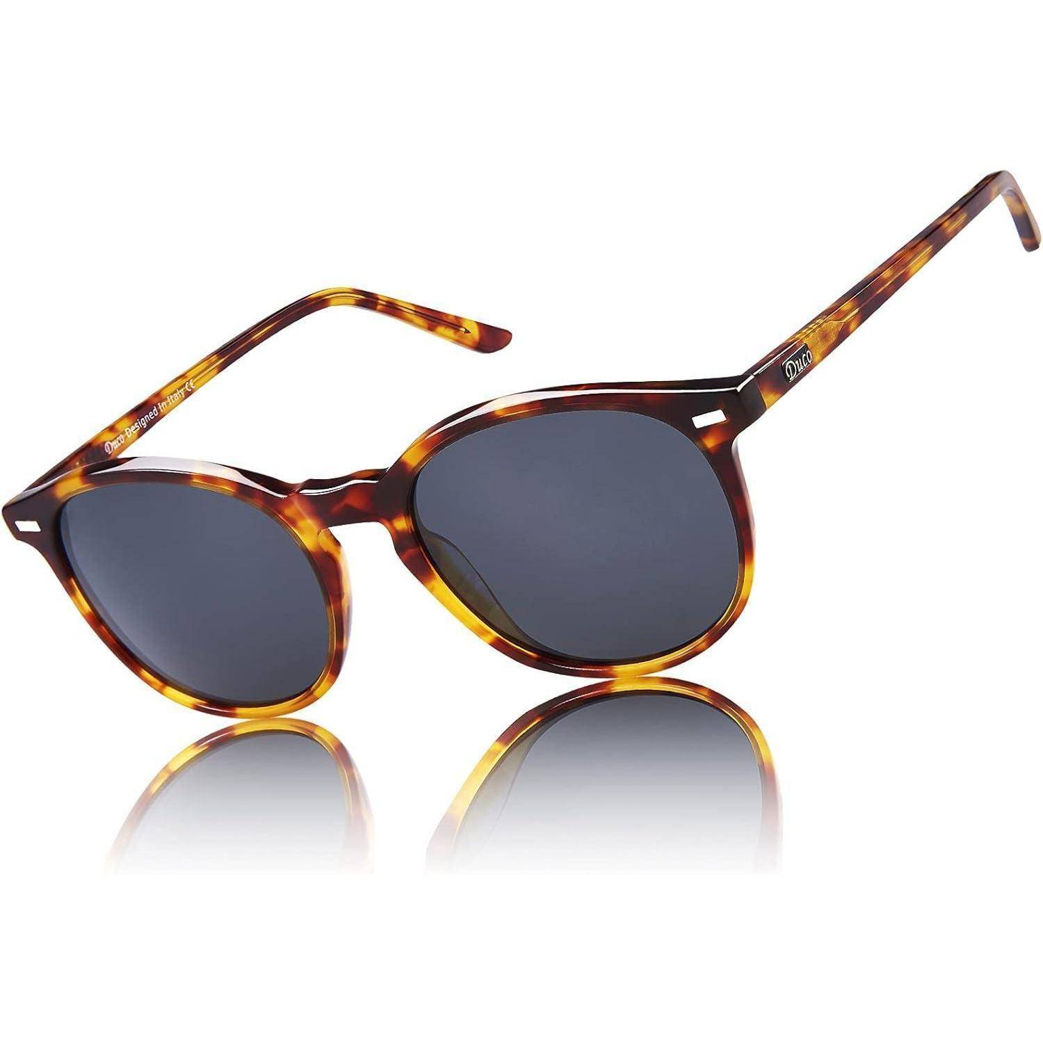 Schildpatt-Sonnenbrille mit runden Rahmen und dunklen Gläsern, mit einer leichten Cat-Eye-Form, in einem Winkel fotografiert, der das seitliche Detail zeigt.