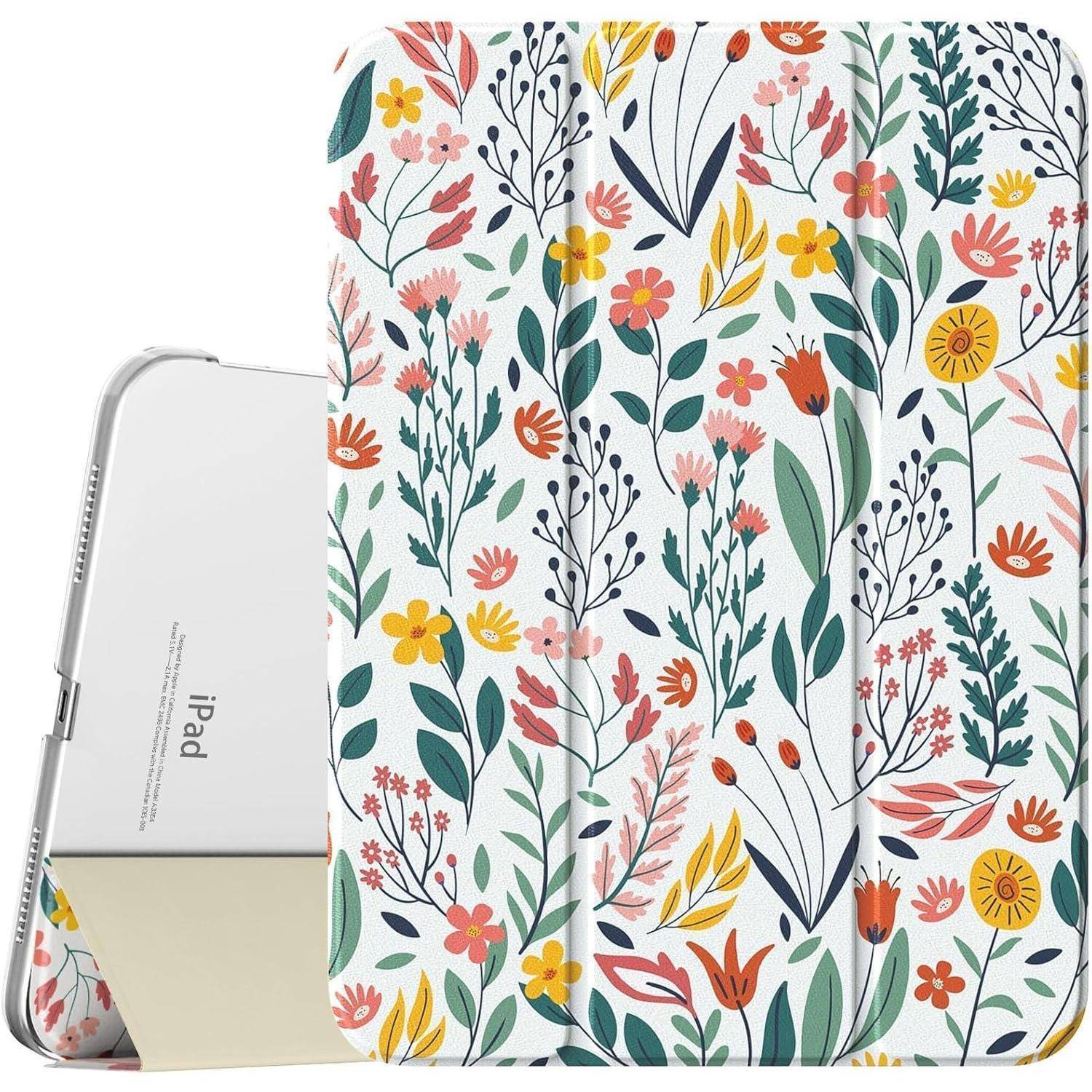 Blumentablet-Hülle mit einer Vielzahl bunter Blumen und Blätter auf weißem Hintergrund, neben einem silbernen Tablet.