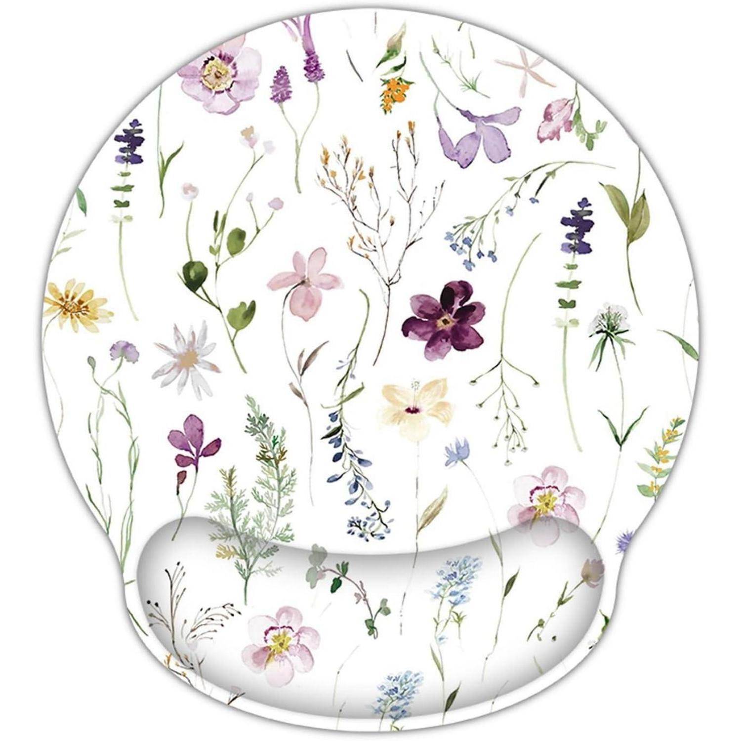 Eine runde, transparente ergonomische Handgelenkauflage mit verschiedenen zarten, bunten Blumen und Blättern auf weißem Hintergrund.
