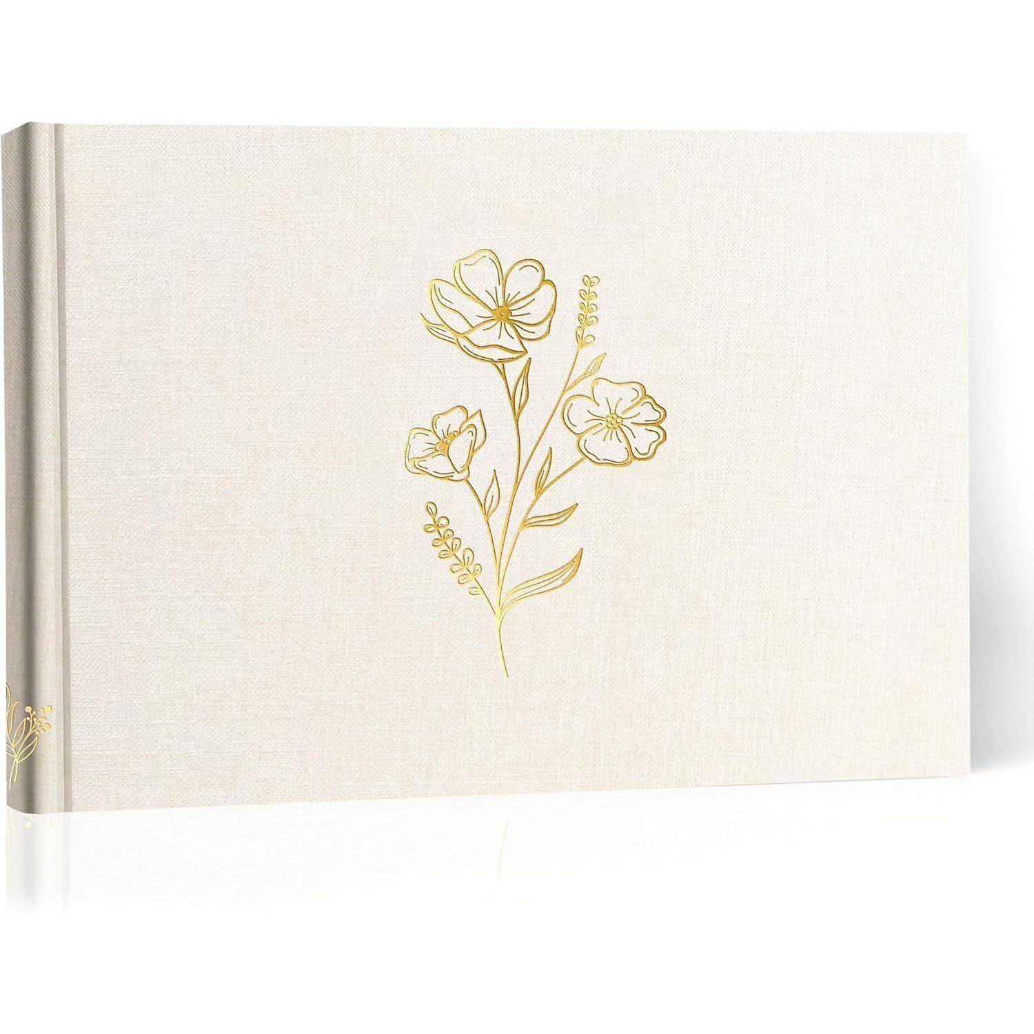 Ein beiger Fotoalbumeinband mit geprägtem goldenem Blumendesign, das drei stilisierte Blumen und Blätter vertikal angeordnet zeigt.