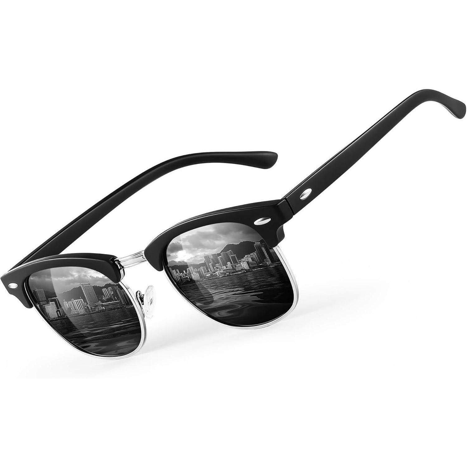 Schwarze Sonnenbrille mit einer Stadtsilhouette, die sich in den Gläsern spiegelt, vor einem weißen Hintergrund.