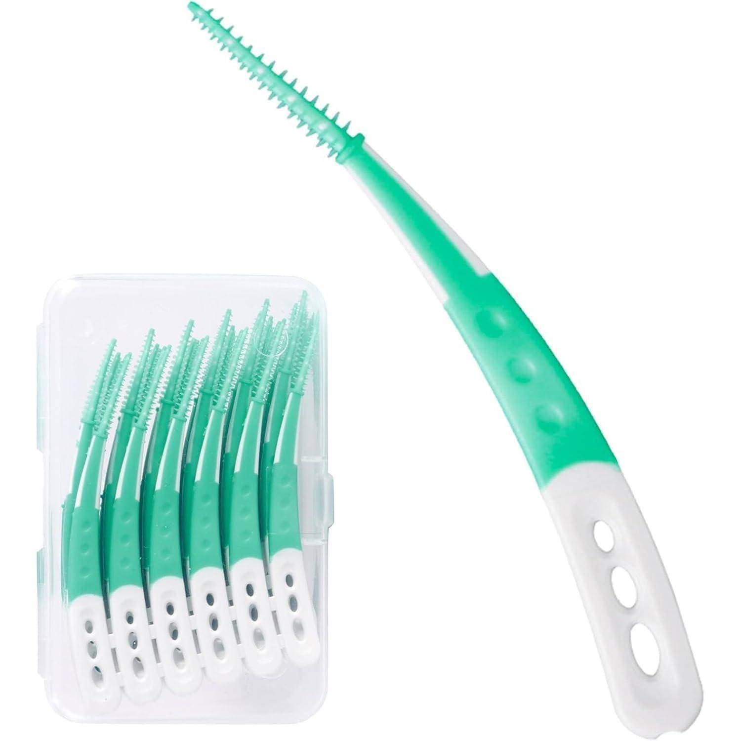 Ein Set aus grünen und weißen Interdentalbürsten, eine einzeln präsentiert und andere in einer transparenten Aufbewahrungsbox gelagert, für die Mundhygiene.