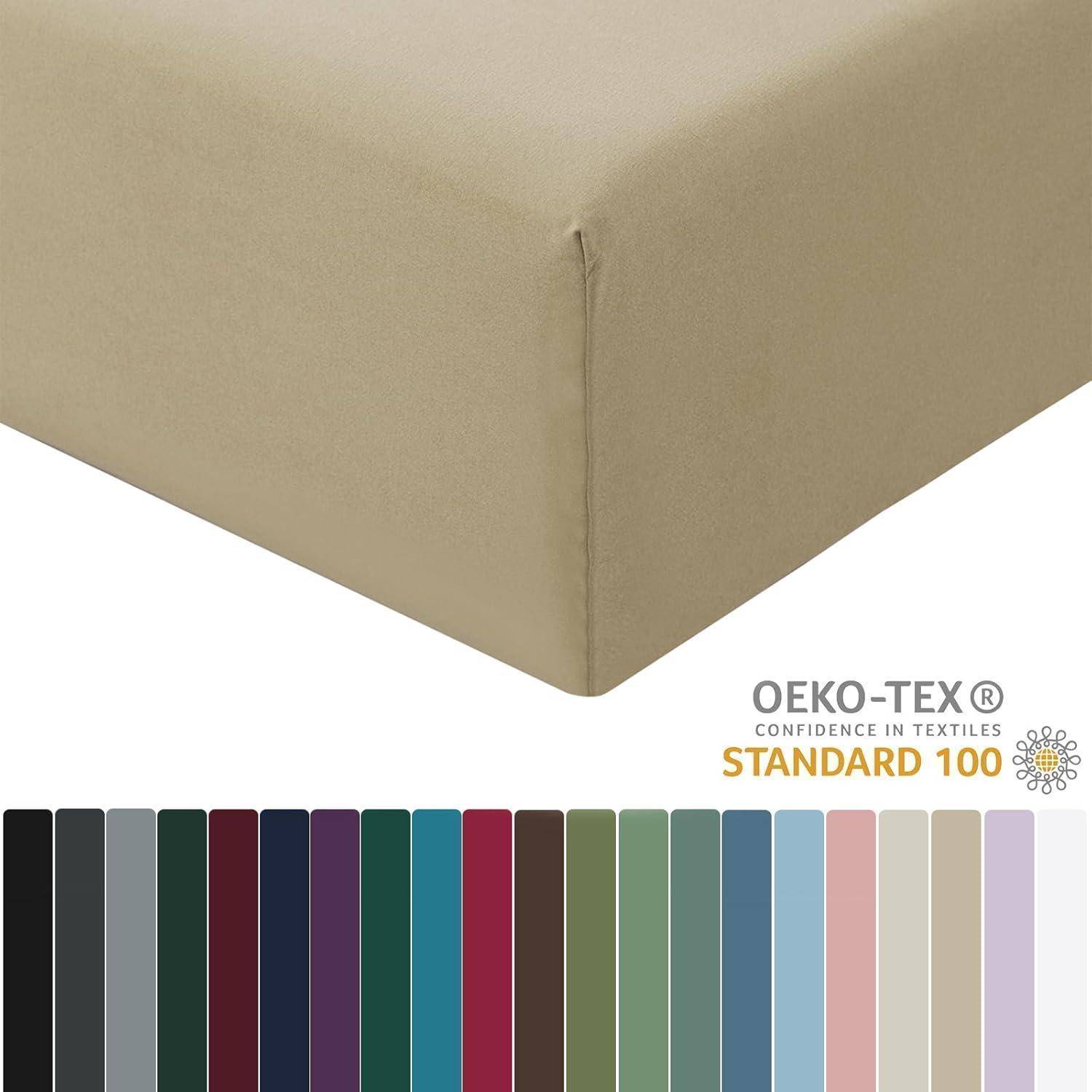 Ein beige-braunes Spannbetttuch wird gezeigt mit einer Reihe von Farboptionen darunter. Das Logo liest sich „OEKO-TEX STANDARD 100, Vertrauen in Textilien