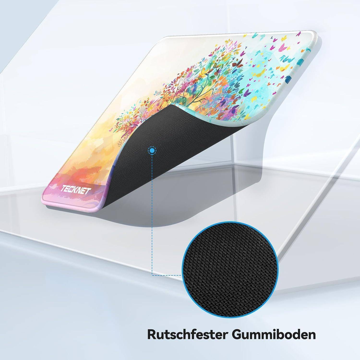 Ein bunter Mauspad mit einer rutschfesten Gummiunterseite. Text lautet: 'Rutschfester Gummiboden'.