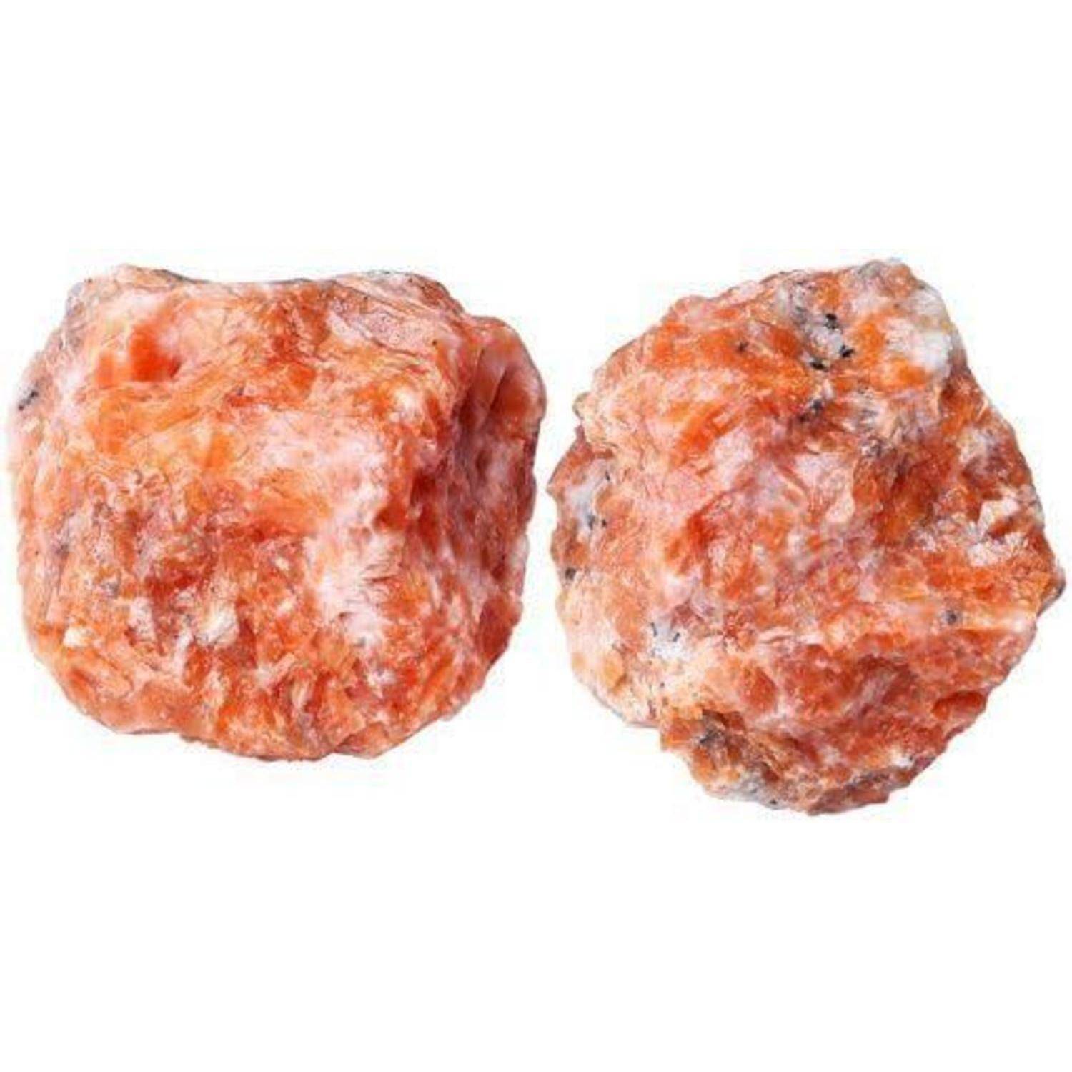 Zwei raue, ungeschliffene rötlich-orangefarbene Mineralsteine mit weißen und grauen Flecken, die eine natürliche, strukturierte Oberfläche zeigen.