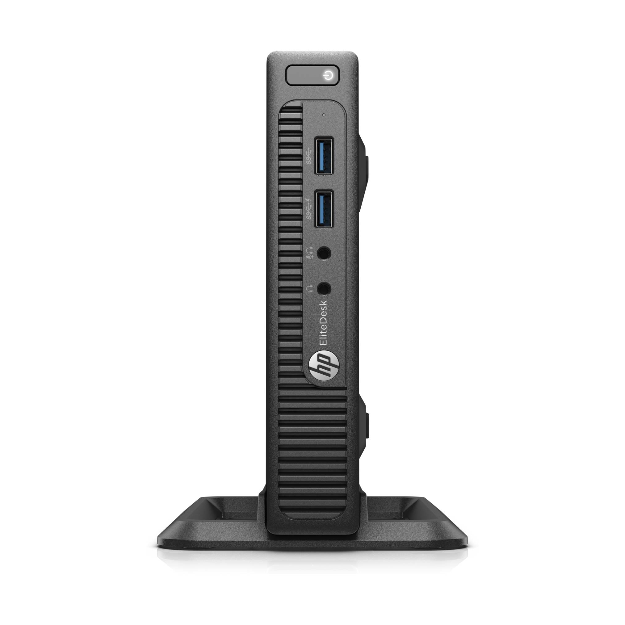 Ein schlankes, schwarzes elektronisches Gerät, das vertikal steht und eine belüftete Frontplatte, zwei USB-Anschlüsse und einen Kopfhöreranschluss aufweist.