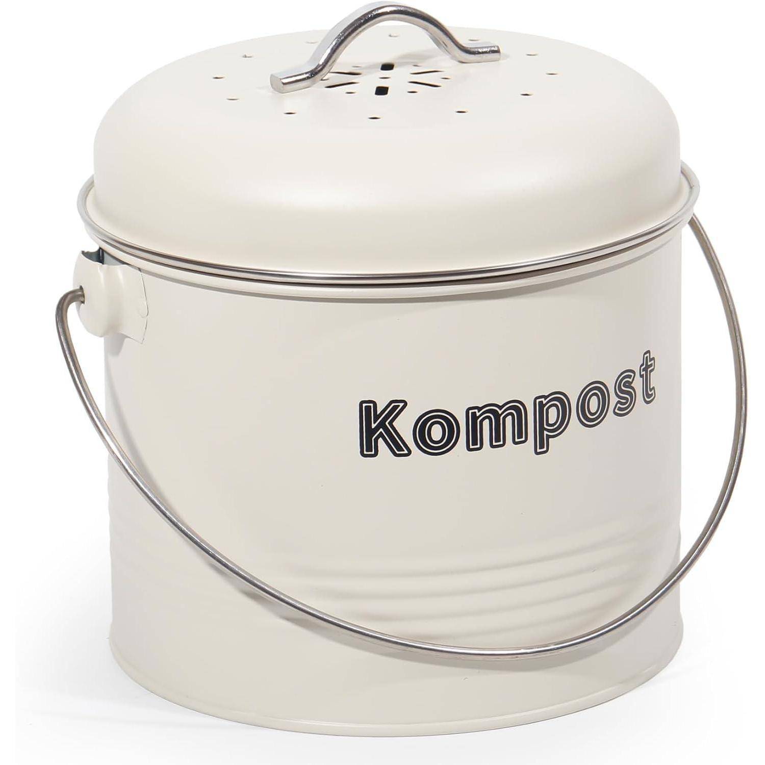 Cremefarbener Kompostbehälter mit Griff und Deckel, beschriftet mit 'Kompost.