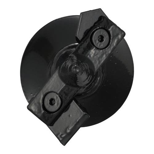 Eine schwarze Gusseisen-Wandankerplatte, kreisförmig mit zwei Bohrlöchern, die zur Abstützung von Wänden gegen seitliche Kräfte verwendet wird.