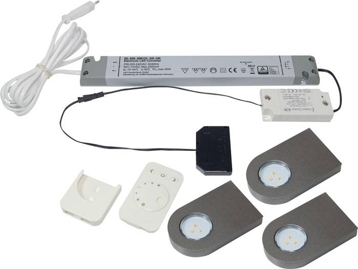 LED-Unterbaubeleuchtungsset mit Netzteil, dimmbarem Schalter und drei runden LED-Leuchten, geeignet für die Küche.