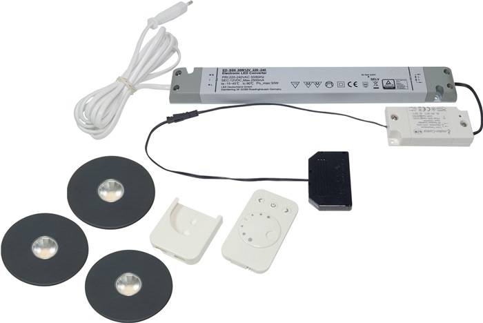 LED-Beleuchtungsset mit Kabel, Netzteil, drei runden Leuchten, Fernbedienung und Montagehalterungen für einfache Installation.