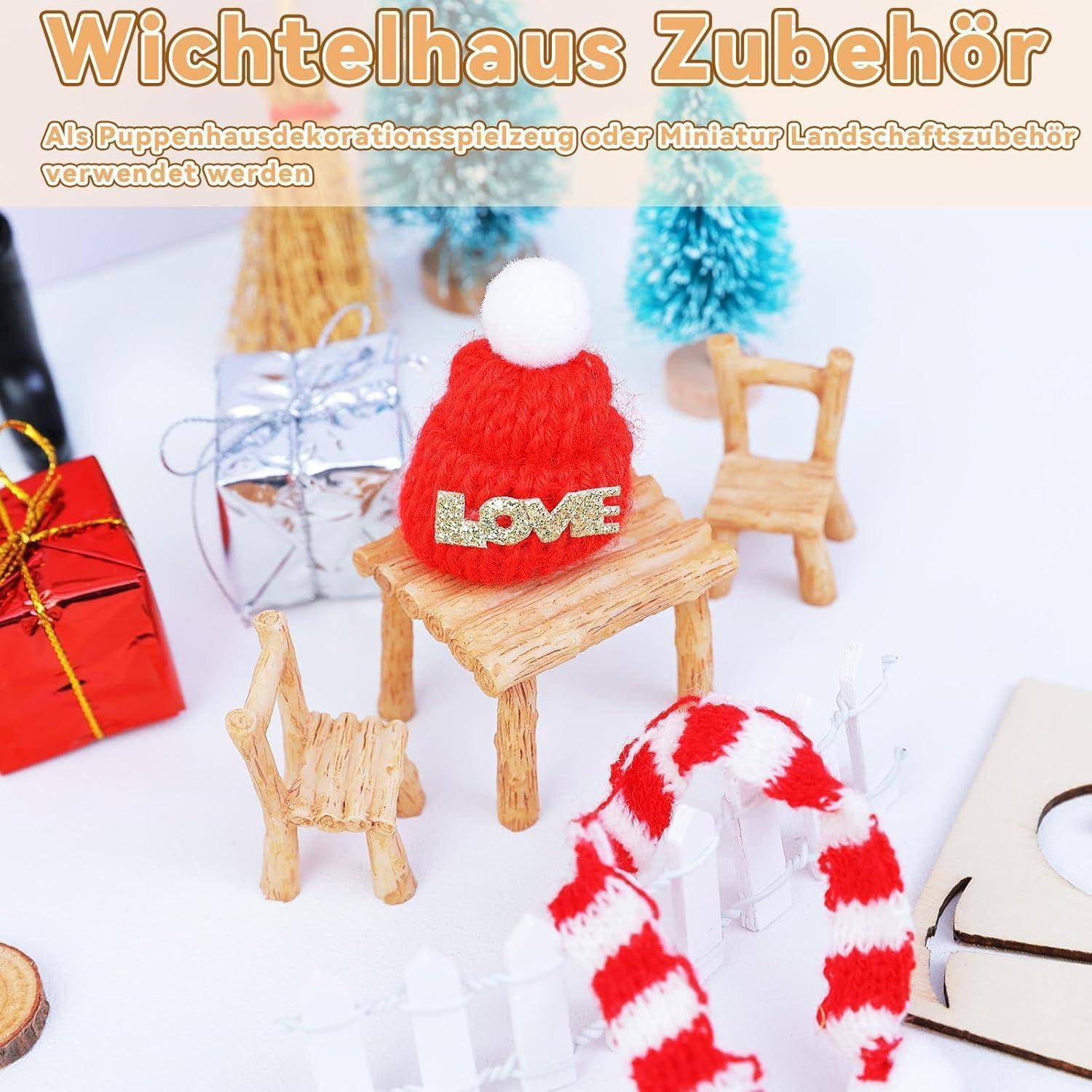 Kleine festliche Szene mit einer roten gestrickten Mütze, auf der 
