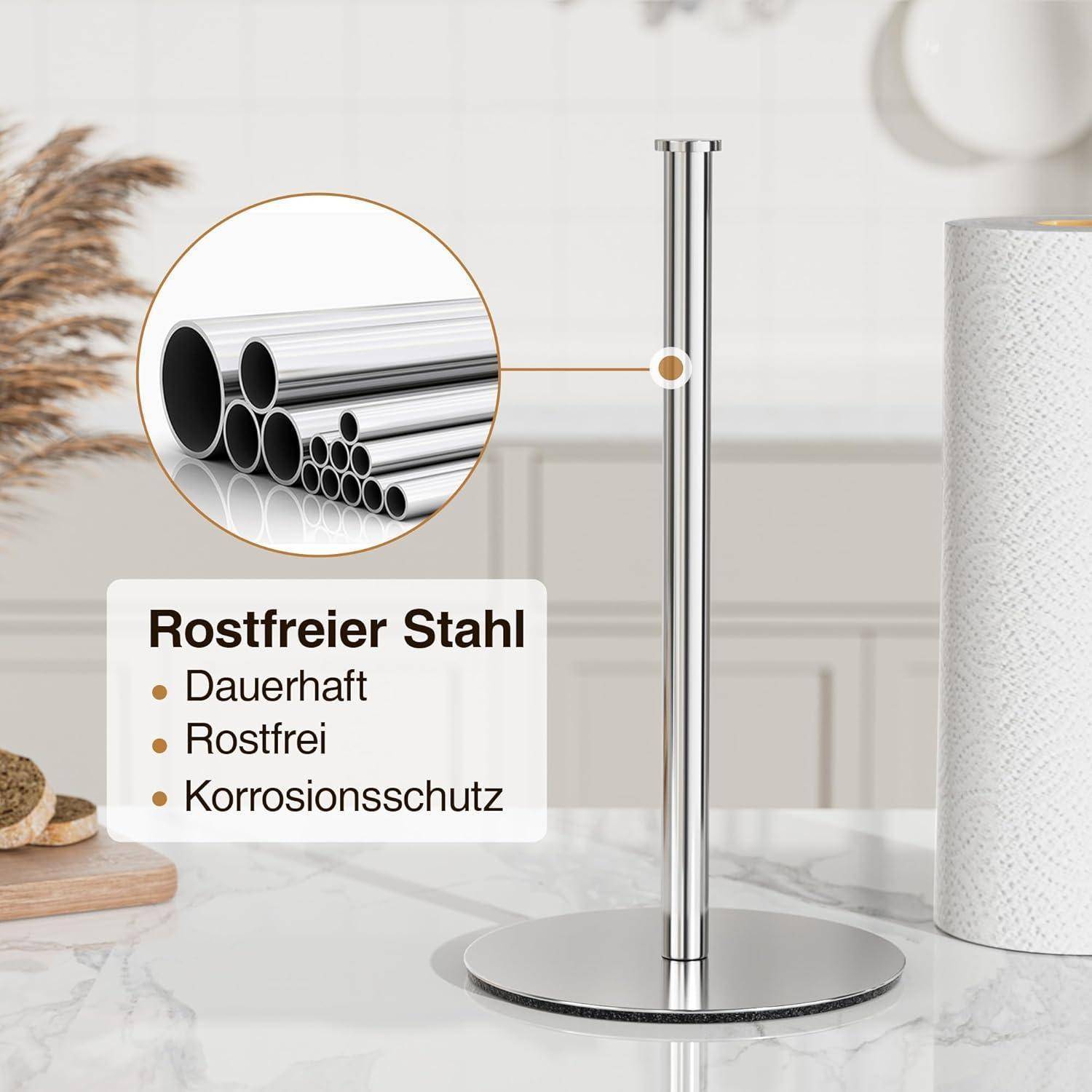 Ein schlanker Papierhandtuchhalter aus Edelstahl auf einer Küchenarbeitsplatte, der die Vorteile des 'Rostfreien Stahls' hervorhebt mit Merkmalen: langlebig, rostfrei, korrosionsbeständig.